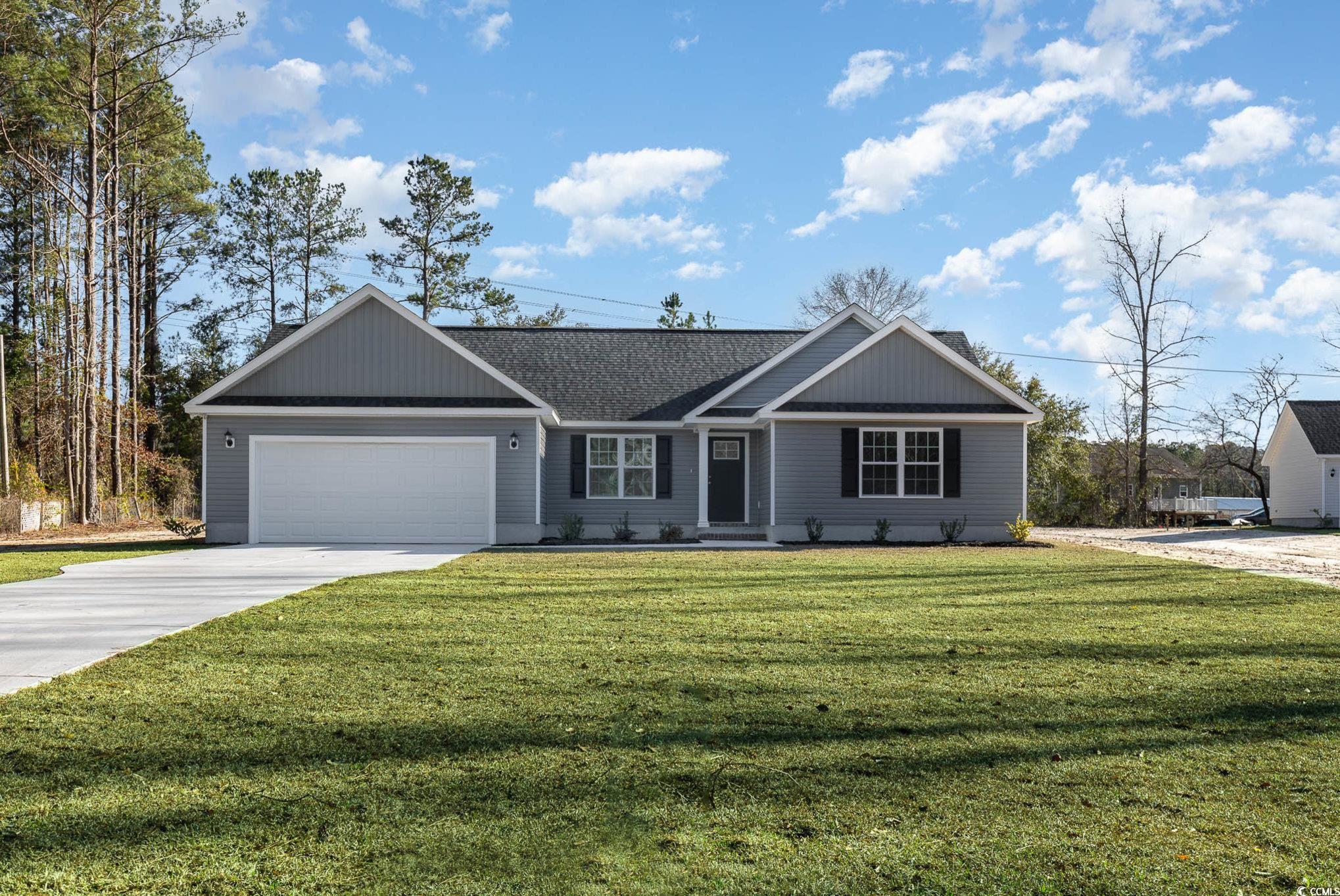 new construction on .76 acre homesite! with a boat landing and no hoa! the cypress 4 model is a ranch with 4 bedrooms and 2 bathrooms. there is a nice sized living room with a ceiling fan, the open kitchen has stained shaker style staggered-cabinetry, granite countertops and stainless steel appliances . the home has vinyl plank flooring in main living areas and laundry room, ceramic tile in bathrooms and carpet in all bedrooms. the master bedroom features a tray ceiling, walk-in shower and a nice sized walk in closet. there is a covered rear porch and patio, which are perfect for entertaining.  building lifestyles for over 35 years, we remain the premier homebuilder of new residential communities and new home construction along the grand strand. we are the 2023 readers' choice for residential realestate developer. in addition, we hold the back-to-back title for best home builder from the sun news and wmbf news. we're appreciative to remain the grand strand's award-winning builder, and we're excited for you to experience the local pride we build today and every day in horry and georgetown counties. welcome home at yauhannah lakes!  home to be completed in january 2024.