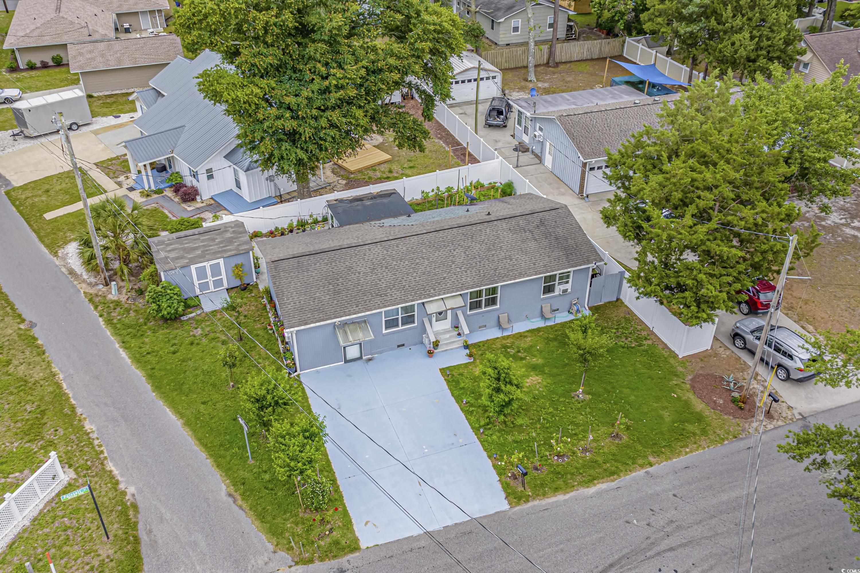 are you ready to embrace the beach lifestyle you've always dreamed of? look no further! this stunning property in the heart of windy hill, east of highway 17, offers you the perfect opportunity to experience coastal living at its best. with easy access to the beach, shopping, entertainment, and restaurants, this is the place you've been searching for.  imagine having the beach just a short golf cart ride away from your doorstep! enjoy the sun, sand, and surf whenever you desire.   this charming house has been meticulously renovated in 2020.  carport was converted to bonus room, carolina room was added, all new wood and lvp flooring, kitchen updated with new cabinets, corian countertops, stainless steel appliances, new fixtures, and bathrooms were partially updated.  exterior of home was painted,  new windows, new stucco finish on front side of home, and concrete patio and storage shed added on rear of home. don't miss out on this incredible opportunity to live the beach life you've always dreamed of.