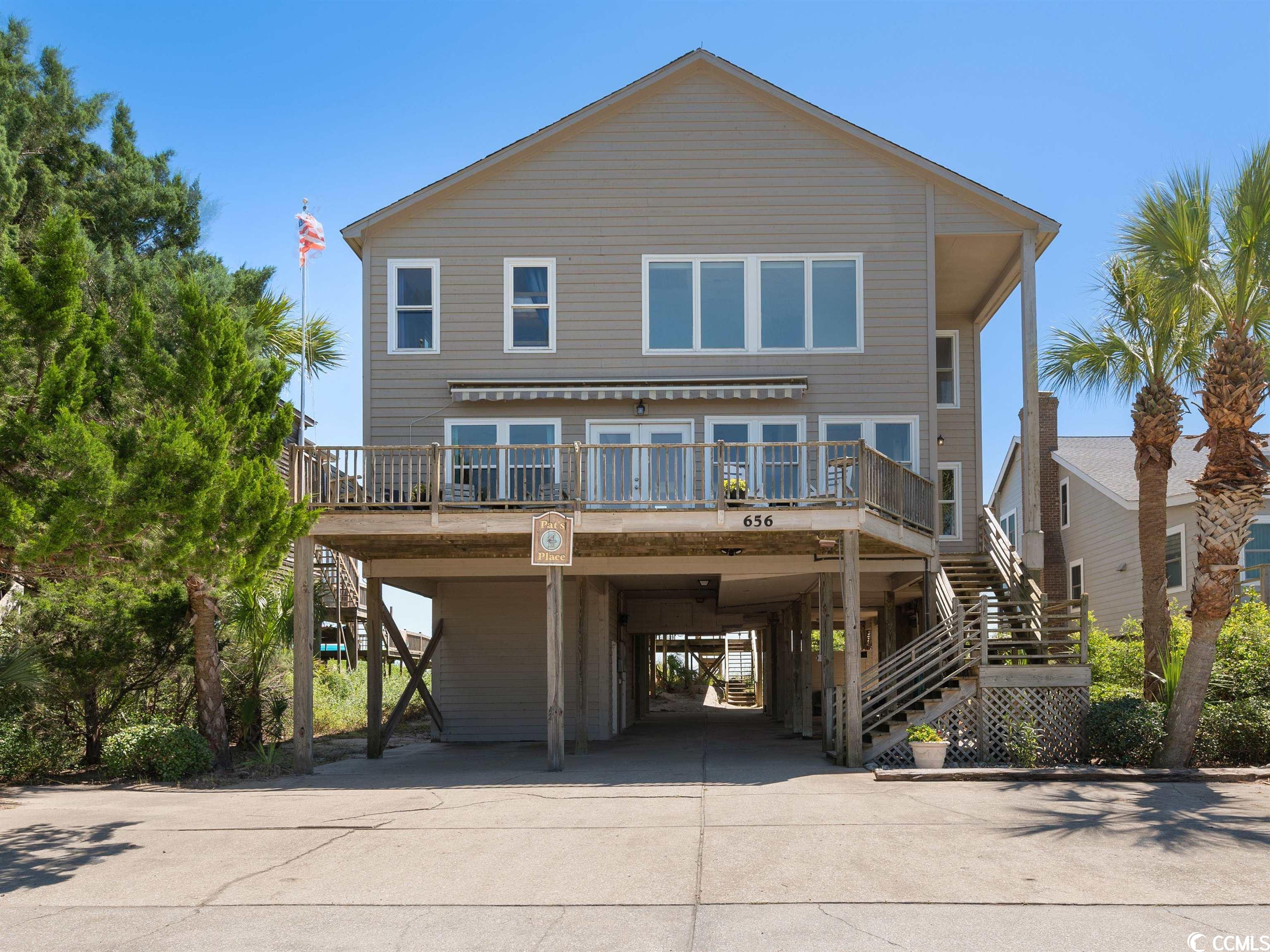 this home is pawleys island. no chandeliers or ultra-modern furnishings. a beach home the way they were meant to be. it's located ocean front and creek front with a dock. this 7 bedroom, 4.5 bath residence sleeps 20 and would be great for a large family getaway or as an investment / rental income property. other home features include a large game room with an incredible ocean view along with a multi volume library. the massive kitchen was designed to handle the largest of gatherings.  there are 2 dishwashers, 2 refrigerators, a stove / range and an additional under-countertop jenn-aire range. there's parking for about 8 cars, along with 2 beach showers and a fish cleaning station underneath the home. the back screened porch has room for relaxing or enjoying your breakfast; or when you have nap time there's no place better than in the pawleys island rope hammock. from there you spend a few minutes listening to the waves pounding on the shore; but then... "night night". there is an elevator for easy accessibility. the homes front porch is the perfect spot to enjoy a glass of wine and watch the sunset after a hard day in your beach chair. ready for some flounder and crab? the creek dock gives you a great place to catch them. it also provides you a place to tie off your jon boat and jet ski. the description of this wonderful home could continue, but it's better to see it for yourself. make plans to see 656 springs avenue as soon as possible.