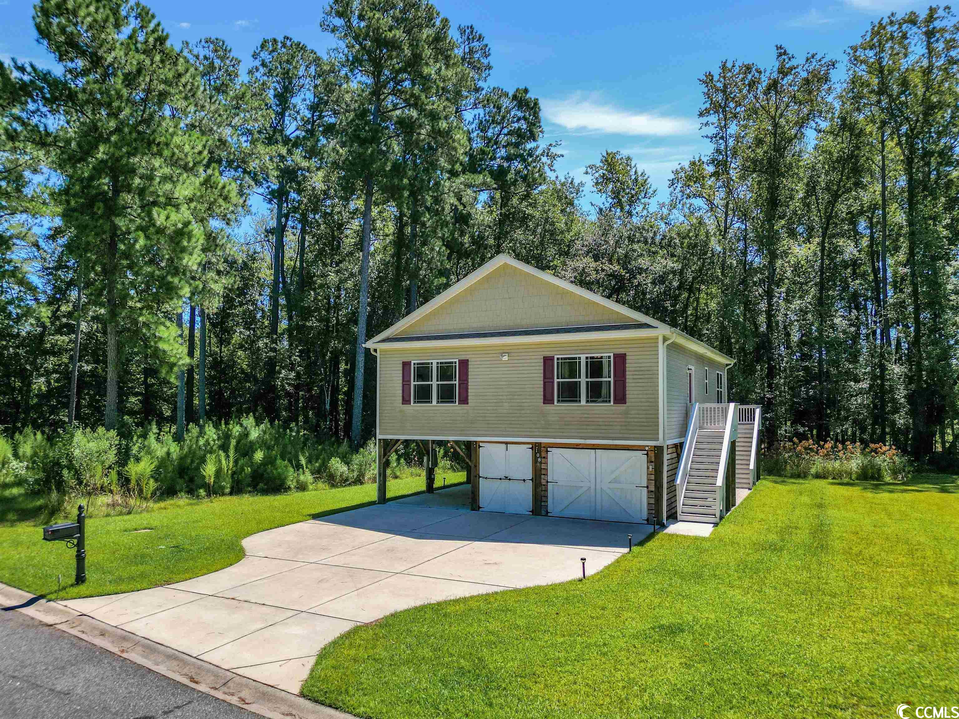 the perfect home to enjoy the coast & country lifestyle many move to the myrtle beach area for. this river style home features granite counter tops, stainless steel appliances, luxury vinyl plank wood flooring, and an open floor plan. the master bedroom features a tray ceiling, walk-in closet, and an en-suite with a deluxe sized shower.now upgraded with partially enclosed 3 car garage on one side of the lower level, and lots of storage underneath. fish from the shared community waterway  shore banks, bird watch from the community pergola, or launch your boat from the boat ramp.  here you will find lots of opportunities for outdoors activities such as jogging, biking, and trail walking. built on 8-foot piers. black water cove is filled with endless possibilities to explore the great outdoors. other features include htc internet fiber, camera security system front, back yard and garage coverage 3 car enclosed garage, utility bay, with auto opener, and keypad entr. with auto sensoring lights, sprinkler system , heater for outdoor water pipes full rear deck, pavers below deck and along right side towards the rear desk.