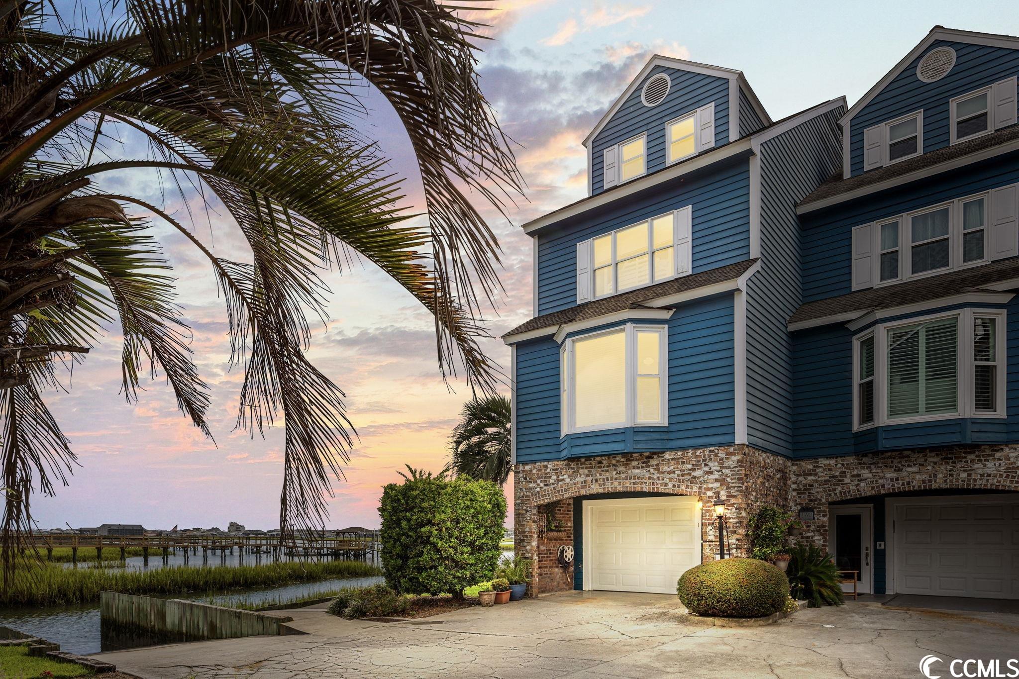 NEVER BEFORE LISTED WATERFRONT PARADISE - END UNIT TOWNHOME with 180 Degree VIEWS of majestic MURRELLS INLET boasting the BEST SUNRISE in TOWN, NEW ROOF 2022, NEW 15 x 15 WATERFRONT PRIVATE DECK, GARAGE with DOWNSTAIRS FLEX ROOM and LOTS of STORAGE, Community BOAT RAMP & POOL. Enjoy spending your summer evenings crabbing or clamming in the fall right off your deck. From the moment you arrive in the quaint 12 HOME COMMUNITY of Pt. Gilead you instantly appreciate the abundance of nature on the Inlet & the lifestyle it affords you.  3 Bedrooms & 3.5 Baths EVERY BEDROOM and EVERY ROOM in the HOME has a WATERVIEW! Tastefully decorated to entertain open & functional in design the living room & sunroom invite the outdoors in with NEW WINDOWS.  The space is made complete with a GAS FIREPLACE and FORMAL DINING AREA. Step into the well appointed kitchen and you'll find GRANITE counter tops, stainless steel appliances, breakfast bar and a COZY DEN. Head outside take a dip in the pool, put your boat in the water and head on down to the FAMOUS MURRELLS INLET MARSHWALK to enjoy Fresh Local Seafood, Live Music and smiling faces daily. 20 minutes to Myrtle Beach International Airport.