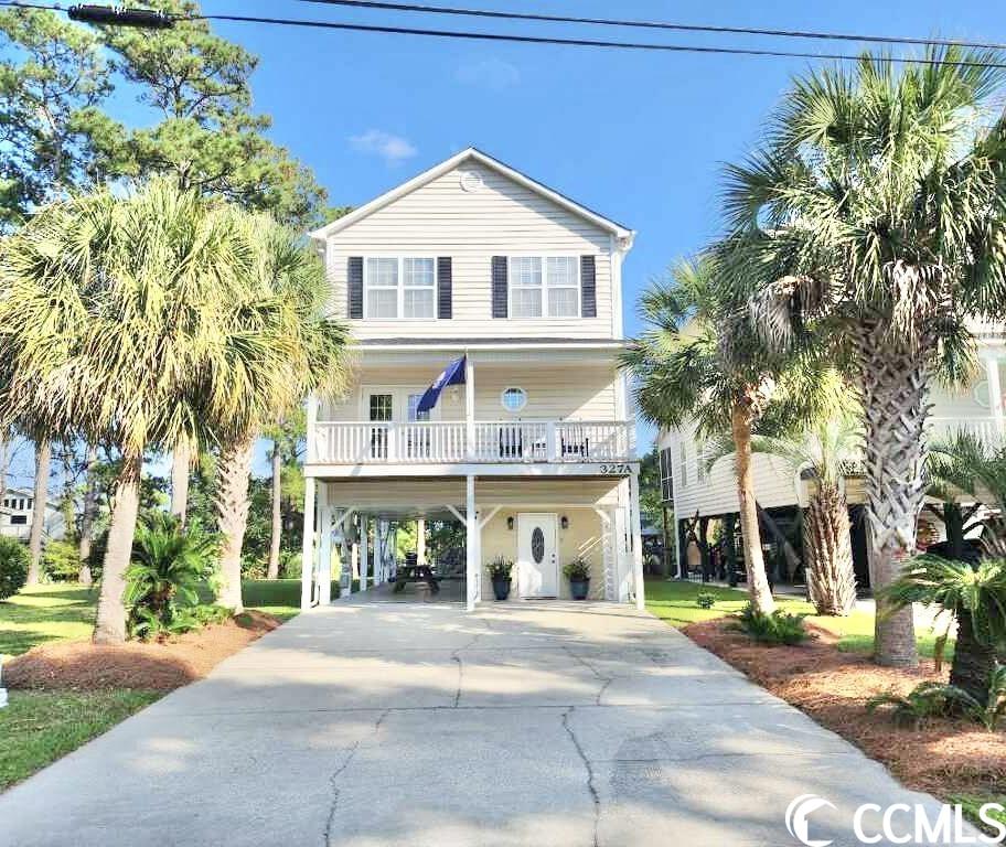 amazing 4 br/3.5 bath raised beach home with gorgeous lake views!!! have you been looking for a turn-key home within walking distance to surfside beach that will work well as either your primary residence or a beach getaway/short term rental??? if so, this beauty is the one! you'll love the lifestyle this home offers. from the outside, when you're not sunning/swimming at the "family beach", you'll enjoy countless hours on the huge screened-in porch as well the patio overlooking the lake. you'll also love peaceful mornings sipping coffee on the front and/or master br balconies. below the house you'll find a very spacious attached storage closet, siting area, as well as golf cart storage & workshop! you'll also have an irrigation system to keep your grass green during the warmer months. the heated/cooled entryway offers great space as a drop zone prior to going upstairs where you'll find the main living floor. you and your guests will fall in love with the upgrades throughout which include wood-look tile flooring in the dining & living rooms, stainless steel appliances & granite countertops in the kitchen, in-law suite on the main living floor, granite countertops in the bathrooms, and an over-sized master bedroom with walk-out balcony. as an added bonus, this home offers plentiful storage space including the attic, which spans the depth of the house! while living/vacationing east of hwy 17 business in surfside beach, you'll love golf carting to the beach & local restaurants. as the new owner of this home you will never be far from dining, golfing, fishing...sand, sun and fun!!!