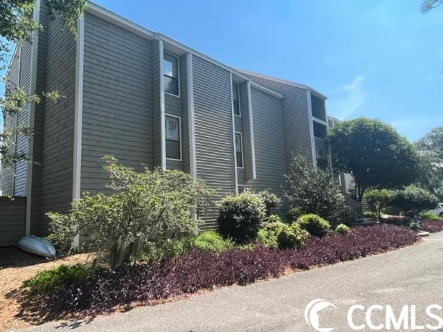 Very rare opportunity, the last sale in this community was a year ago! This marsh front community embraces the Pawleys Island lifestyle focusing on low country waterfront living. Community has an amazing dock for hanging out, fishing, or launching your paddleboards, kayaks, etc. The community pool provides a great location for family fun! Don't miss out on all Pawleys Island has to offer, shopping dining and endless water activities. This serene home boasts a wonderful view of the marsh and is ready for a new family. Double sliding doors allow for unobstructed waterfront views from the open living room, kitchen, dining area. Stainless appliances, and spacious dining are just a few of the wonderful features. New stove and heat pump/air handler in 2022. Totally private, large screened in balcony for morning coffee and sunrises or shaded quiet evenings. Unmatched wildlife watching. Please call to tour this home today, won't last!