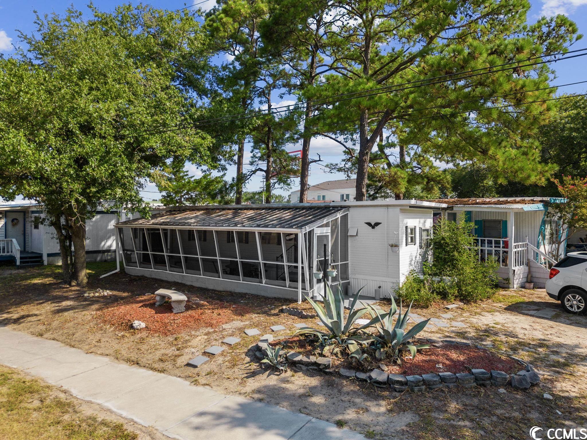 windy hill beach cottage recently remodeled and fully furnished! just a few blocks to the beach, barefoot landing, dining, shops, entertainment, ice cream and mini golf. golf cart access to everything you would want or need. excellent for primary residence or rental income producing investment property. leased lot in windy hill mh park.