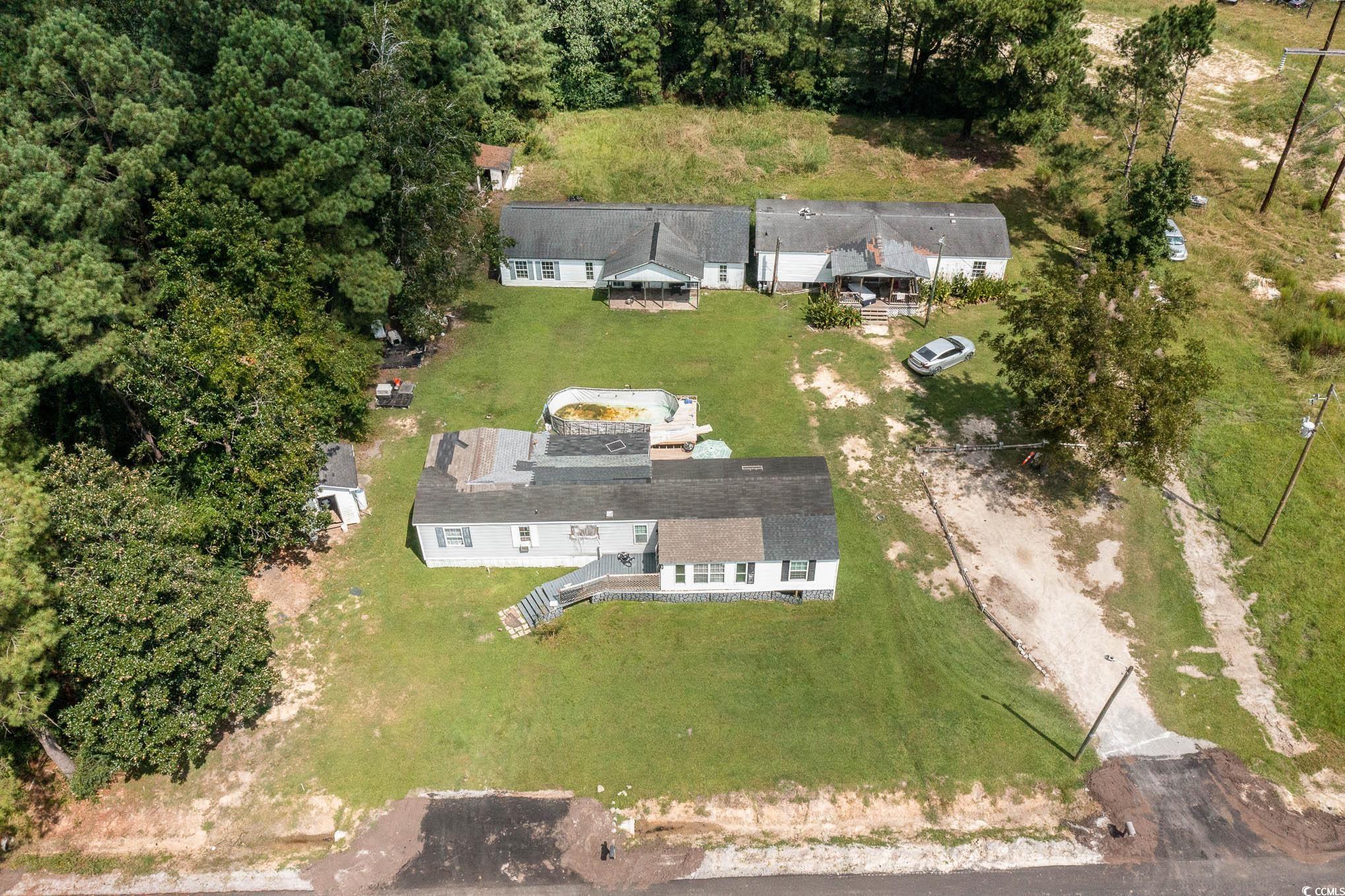 a unique opportunity to own this 1.52 acre property with 3 manufactured homes. 3 beds, 2 full baths. great possible multi-family living opportunity or rentals.  also available for sale is the 1.30 residential rural lot next door mls#2318314. sell the mobile homes and combine to have a large nearly 3 acre lot to build your dream home.  an area that is growing and slated for more development and services including city water, sewer, cable tv, and high speed internet. combines the tranquility of rural living with the convenience of being just minutes away from the city's amenities. conway, sc offers a welcoming community with a rich history and a vibrant cultural scene. the town is renowned for it's charming downtown area, lined with quaint shops, delicious restaurants, and art galleries. additionally, residents can take advantage of the nearby waccamaw river, providing opportunities for boating, fishing, and other water activities.