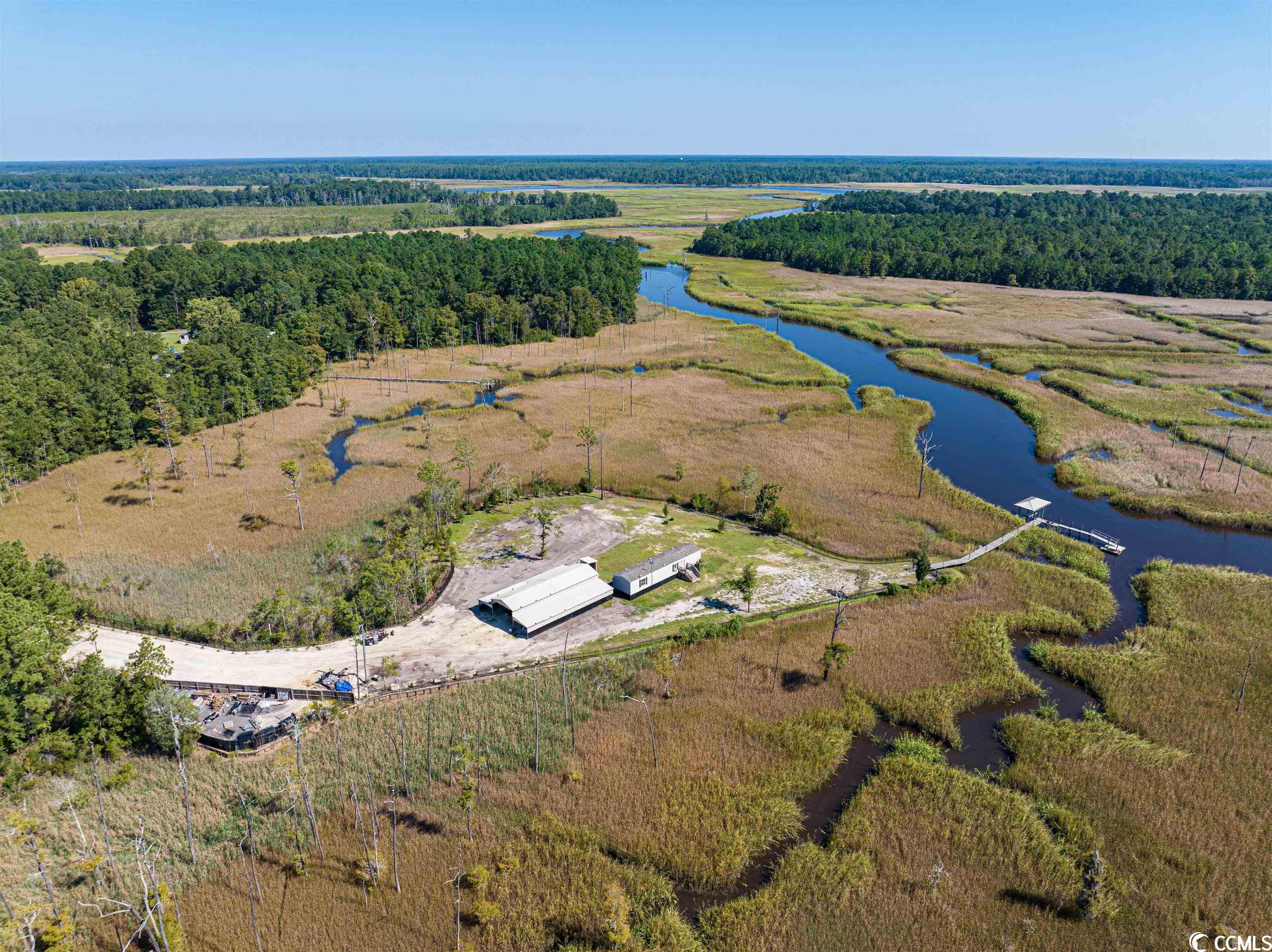 great deal on waterfront property!! don't let this one pass. this 16 acre tract consists of 1+/- acre of high land and 15+/- acres of marsh. there is a 16x60 2 bed 2 bath mobile home that comes with the property.  also, on the property is an 41'x60' metal build with two containers that have been turned into a workshop. the high land is positioned where you will have a panoramic view with ample amounts of privacy.  10 min boat ride to georgetown and 4 miles by car.