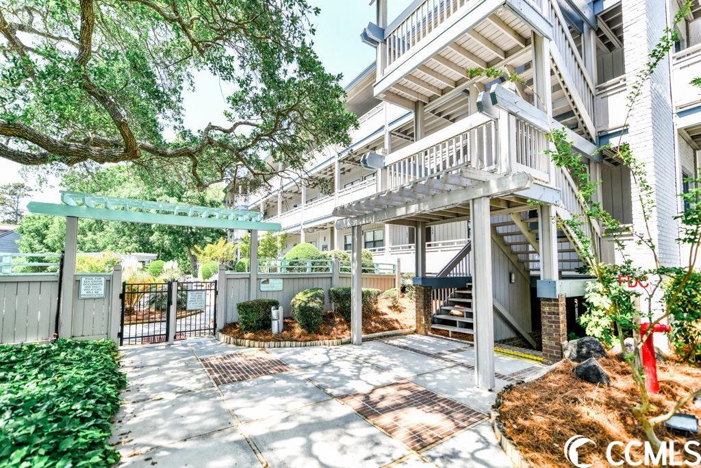 this spacious 3 bedroom, 2 bath condo is located in the sea grove community and is just one short block to the sandy shores of surfside beach.  complete with coastal furnishings and decor, this beautiful retreat can be used as a second home, vacation rental or long term rental.  well maintained, this condo includes luxury vinyl floors in the living and dining areas, ceramic tile in the kitchen and baths, and decorative chair rail.  the fully stocked kitchen, boasts solid surface counters, stainless steel appliances and a breakfast bar that opens to the dining area. outside you will find a large balcony and deck to enjoy outdoor dining or your morning coffee and sunrise.  the sea grove community is situated under mature oaks with tropical landscaping and offers a large outdoor pool area, a covered gazebo, and separate dining area. schedule your appointment today to see the beautiful coastal retreat!