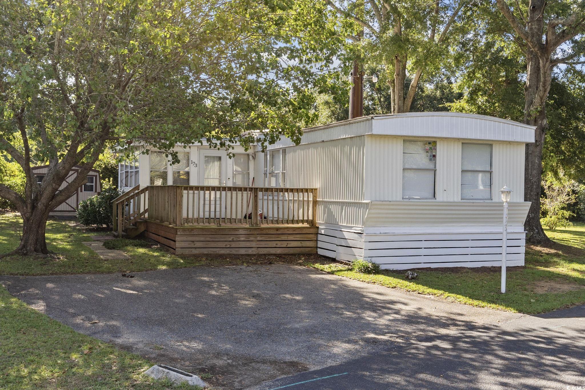 inlet oaks is an active 55+ mobile home community in murrells inlet offering its residents a spacious clubhouse year round for gatherings, games, free wifi, free reading materials and a kitchen to host any function. there are many planned activities by the social club to keep you involved! there is also a pool open seasonly to enjoy with a covered pavilion for picnics, horseshoe & cornhole pits. this home is the perfect chance to own a little piece of coastal living.  it offers 2 bedrooms and 2 baths, great front porch along with a screened in porch and a bonus sunroom to enjoy all the glorious weather south carolina has to offer.  there is a dedicated laundry area and open and spacious kitchen and livingroom.  it is ready for you to come and make it your own. inlet oaks is perfectly situated 1.5 miles from the beach, 2 miles north of the famous brookgreen gardens and huntington beach state park.