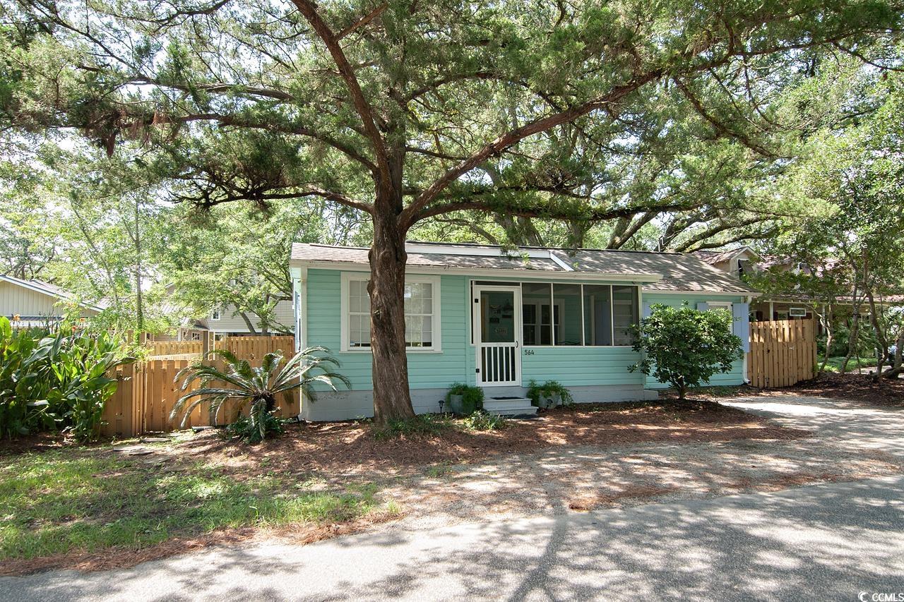 you can't get more pawleys than this! charming and cozy two-bedroom, two-bath cottage is located steps from the creek at the south causeway bridge. the den could easily be used as a third bedroom. although completely renovated, this home retains much of its original character. a majestic live oak shades the backyard where there is a large deck and outdoor shower. the adjacent lot sells with the house providing tons of possibilities - like building your dream home on the corner and keeping the cottage for guests or rentals. amazing island amenities are readily available including the beach, which is an easy bike or golf cart ride away. perfect for a second home or investment property. no hoa. convenient to schools, medical facilities, shops and restaurants. only 70 miles to historic charleston and 25 miles to myrtle beach.