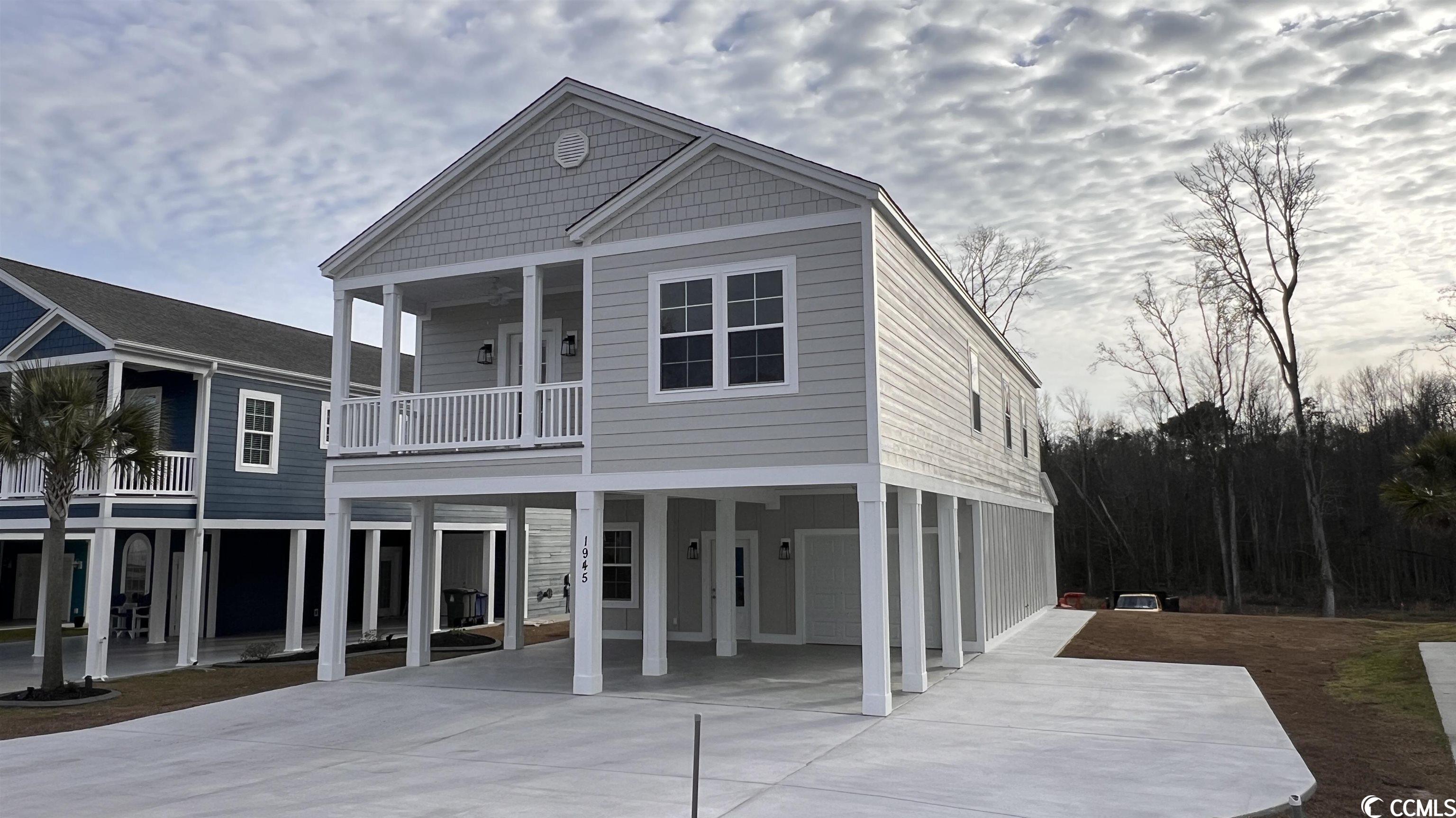 welcome to your dream coastal retreat! nestled within the quaint cross island subdivision in the coveted cherry grove section of north myrtle beach, this exquisite new construction home is destined to become your oasis by the sea. with 4 bedrooms, 3 full baths, over 2400 heated square feet, and an abundance of luxurious features including a private elevator,  this property offers a lifestyle of coastal bliss like no other.  offering ample space for family and guests, this home ensures comfort and privacy with four spacious bedrooms. three beautifully appointed full baths provide convenience and luxury throughout the home. the first floor welcomes you with a large den, a versatile space perfect for relaxation or entertainment. a bedroom and full bath on this level provide flexibility and accessibility. take a ride up the private elevator to second level.  the kitchen boasts granite countertops, a stainless appliance package, and ample cabinetry making it a chef's delight and the heart of the home. enjoy the coastal breeze and scenic views from the inviting carolina room, perfect for sipping your morning coffee or unwinding in the evening. luxury vinyl plank (lpv) flooring graces the entire home. the master suite features a custom tile shower, while the living room boasts a vaulted ceiling, adding an airy, open feel. relish the coastal lifestyle on your spacious front porch, a perfect spot for savoring the coastal ambiance. with parking space under the home and in the driveway, accommodating guests and multiple vehicles is a breeze. the fully sodded yard includes an irrigation system, ensuring a lush and vibrant landscape year-round. this new construction home is not just a property; it's a lifestyle upgrade. enjoy the beauty and tranquility of cherry grove in north myrtle beach while indulging in the comfort and luxury of modern living. whether you're seeking a permanent residence or a vacation getaway, this home checks all the boxes. don't miss this opportunity to make this coastal masterpiece your own.