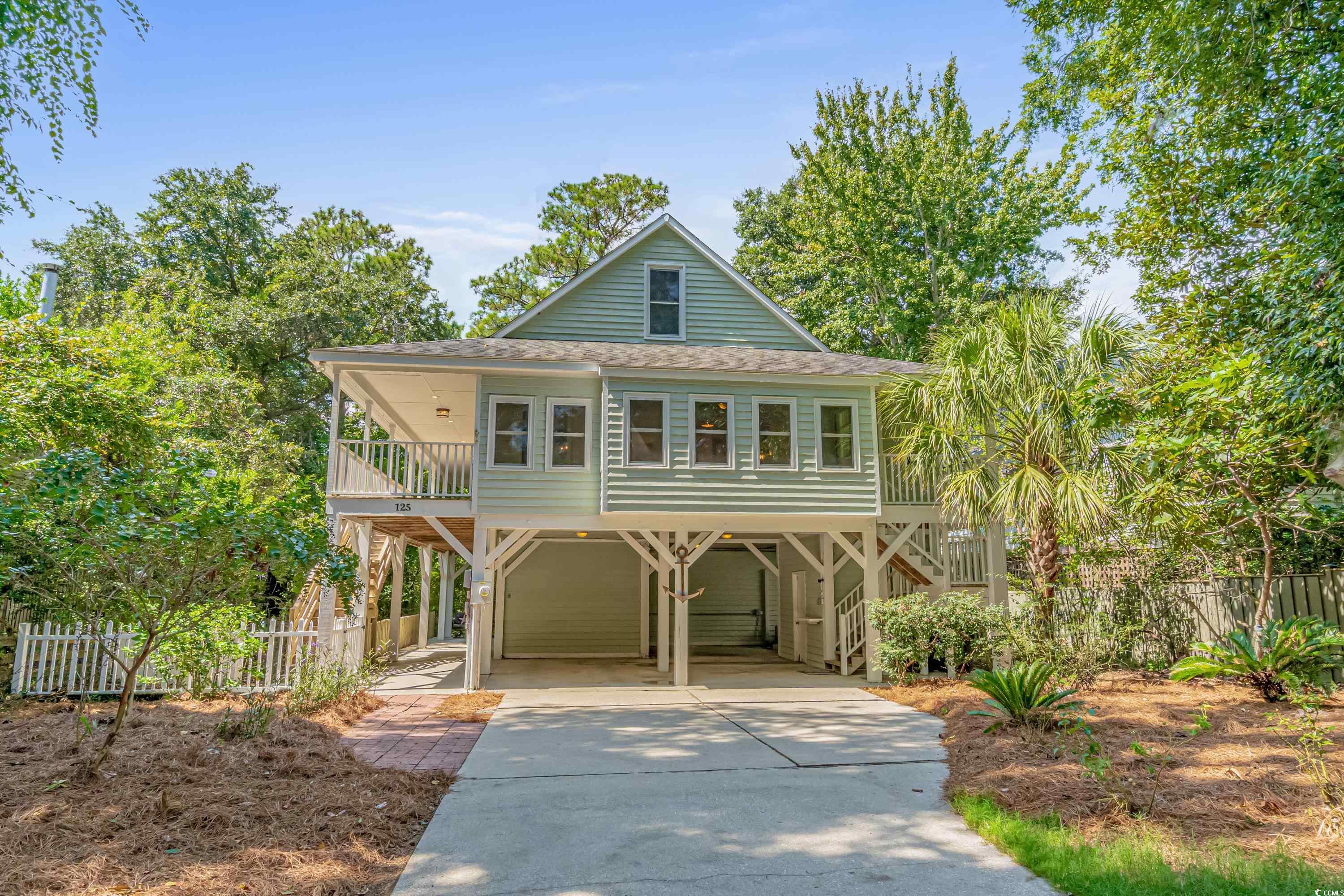 pawleys island inlet view with 5 bedrooms, 4.5 bathrooms, fully functional mother-in-law suite/airbnb apartment, and no hoa offers the epitome of luxury living.  nestled in a serene enclave this home has 3,594 heated square feet including the furnished ground floor suite which is a 1 bed, 1 bath apartment with a full kitchen, currently on a rental program.  the main level of the home has 2 bedrooms, 2.5 bathrooms, and an expansive living space that flows into the gourmet kitchen.  experience views of the inlet through the windows of the sun room and relax or entertain on your private front porch spanning 708 sqft . the upstairs level has 2 bedrooms, 1 full bathroom, a laundry closet and provides ambience via its open concept layout overlooking the main level.  this is more than a home, this is a lifestyle.  don't miss your chance to own a piece of pawleys island paradise....this home has never flooded!