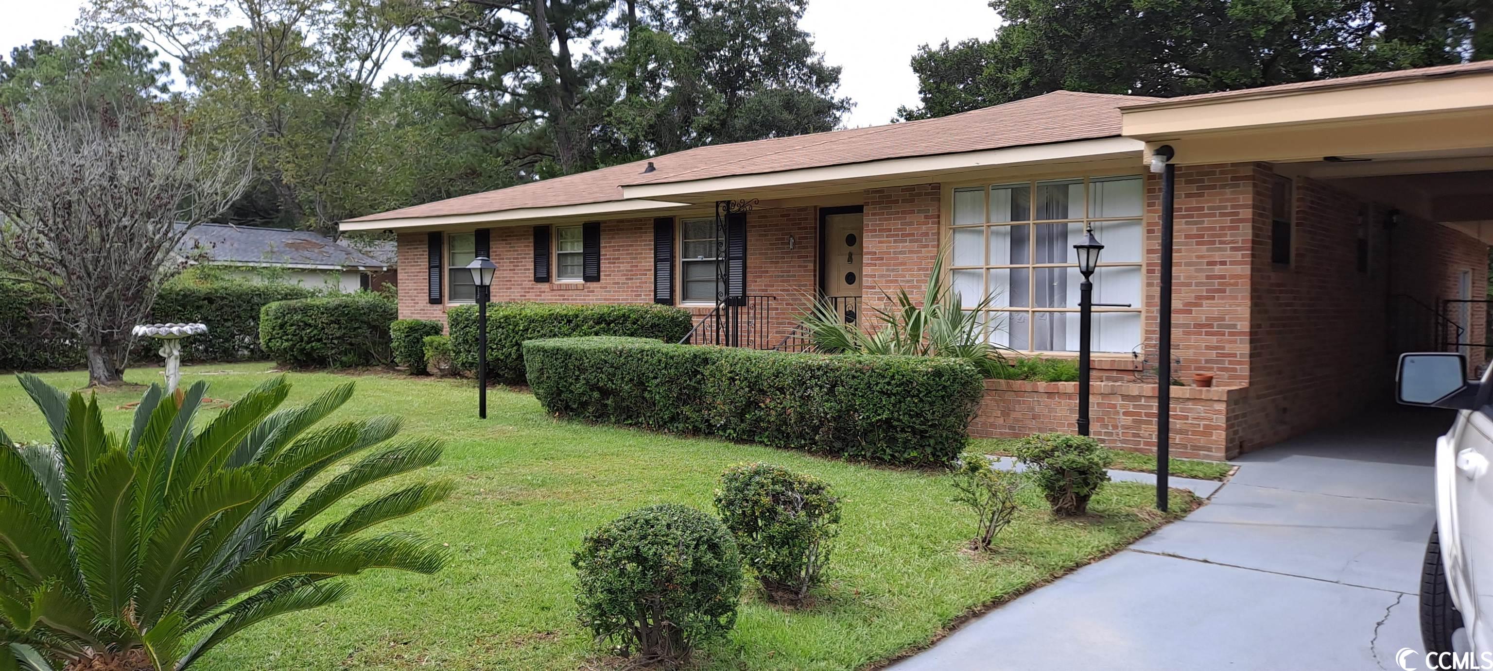 a nice three-bedroom two bath home with a retro vibe. it has a formal dining area, den with fireplace and fenced backyard. minutes from downtown georgetown's restaurants and boardwalk. also, just minutes from east bay park with tennis courts, a one-mile walking path, a boat landing as well as a kayak landing/launch area. about fifteen minutes from pawleys island beach, and go about another five minutes to be at the beautiful huntington beach state park and beach, and brookgreen gardens, which, as of this writing, is named one of the top 10 gardens in the us by tripadvisor. there is also a very nice bike trail in pawleys island. you would be approximately an hour from myrtle beach and approximately an hour and fifteen minutes from charleston. there's a plethora of things to go and do, or you can choose to just relax in this nice home. square footage is approximate and not guaranteed. buyer is responsible for verification.