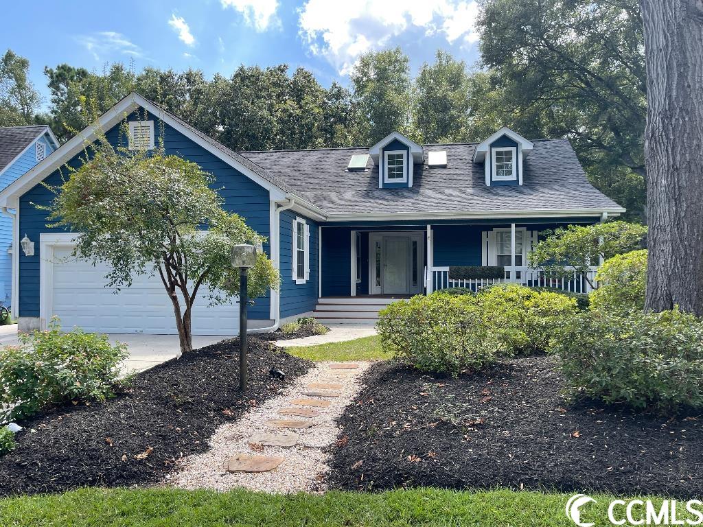 lots of updates on this gem a 10 min golf cart ride to beach.  expanded driveway and garage so ample parking.  new marble and granite in kitchen and baths new tile showers new floors.  front and back porches and spacious backyard buffered by woodlands plenty of room for pool or addition - nordic hot tub!  don’t miss this gem!