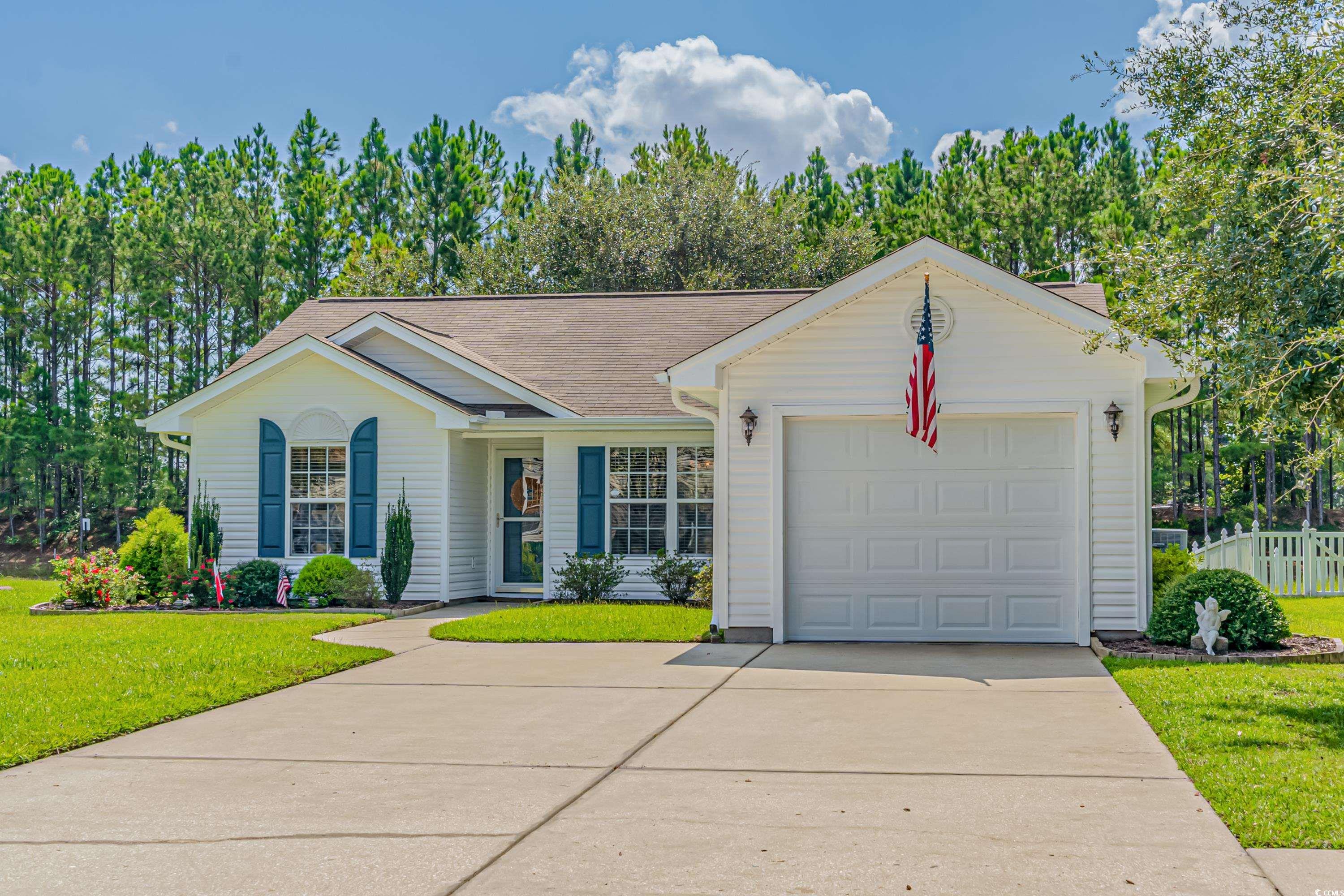 Welcome to this well-maintained 3 bedroom, 2 bathroom ranch style home located in the desirable Walkers Woods neighborhood of Carolina Forest. Enjoy an open floor plan with lots of natural light and vaulted ceilings, plus all new LVP flooring in living room and hallway, new carpets in bedrooms, and tile flooring in kitchen and bathrooms. New roof installed September 2023! The master bedroom features a large window with views of the backyard plus a large walk-in closet for extra storage space. Step outside to your backyard oasis where you can relax under the shady live oak tree while enjoying tranquil pond views! And best yet, you'll be minutes away from beautiful beaches, Intercoastal Waterway access, golf courses, healthcare facilities, gyms & fitness centers shopping & restaurants, schools & universities, walking/bike trails, airports & so much more! Don't wait - schedule your showing today!