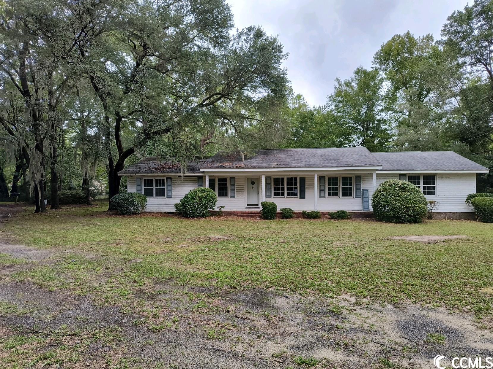 this home is situate on almost 2 acres with a beautiful water view.  this property also has title to the water behind the house and extends to the bank on the other side.  renovation of the house is needed, i.e. carpet, paint and hvac.