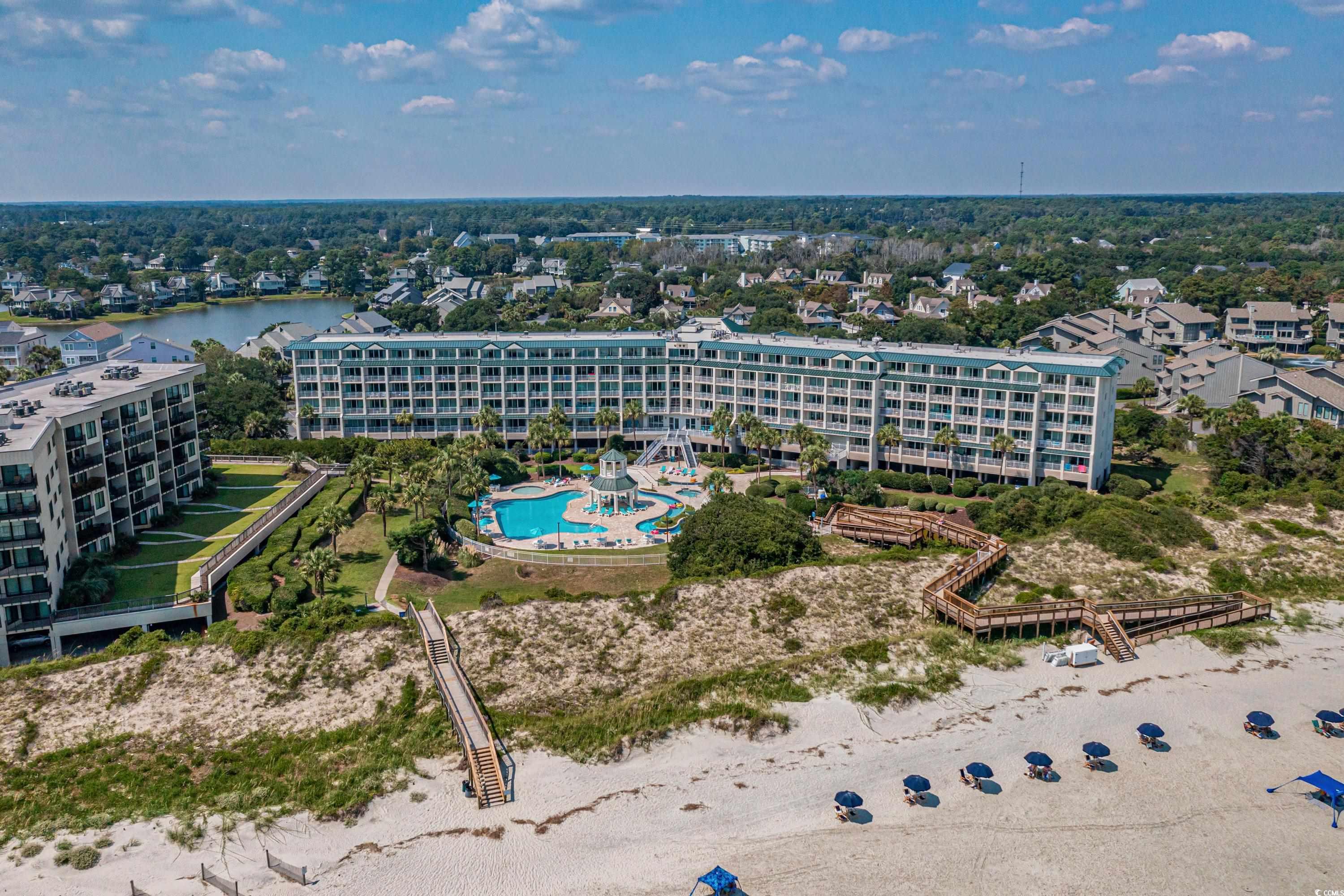 elevate your lifestyle with this exquisite 2-bedroom, 2-bathroom top-floor oceanfront condo located in the exclusive bridgewater community at litchfield by the sea in pawleys island, sc. this turnkey unit has been recently renovated with high-end finishes and boasts panoramic atlantic ocean views that greet you the moment you walk through the door. but the appeal goes beyond the unit itself; living here means embracing a luxurious lifestyle filled with a wide array of amenities. whether you prefer to relax in the lazy river pool, swim year-round in the indoor pool, or unwind in the hot tub, bridgewater has you covered. fitness enthusiasts will appreciate the well-equipped gym, and the private beach access ensures a more intimate oceanfront experience.  litchfield by the sea doesn’t stop at the basics; the community extends its luxury offerings with sunning decks, tennis courts, fishing lakes, and crabbing marshes. active residents will also enjoy miles of scenic bike trails. perfectly situated, this condo offers the convenience of being just minutes away from prime shopping outlets, fine and casual dining establishments, and cultural landmarks like brookgreen gardens and huntington beach state park. adding to its allure, the property makes for a great investment opportunity, thanks to its ideal location and high-end features. the 24/7 security and close proximity to grocery stores and other essentials make it both a practical and luxurious choice. this is an unmissable opportunity, whether you're looking for a vacation home, an income-generating investment, or your permanent coastal retreat. contact us today to schedule your viewing.