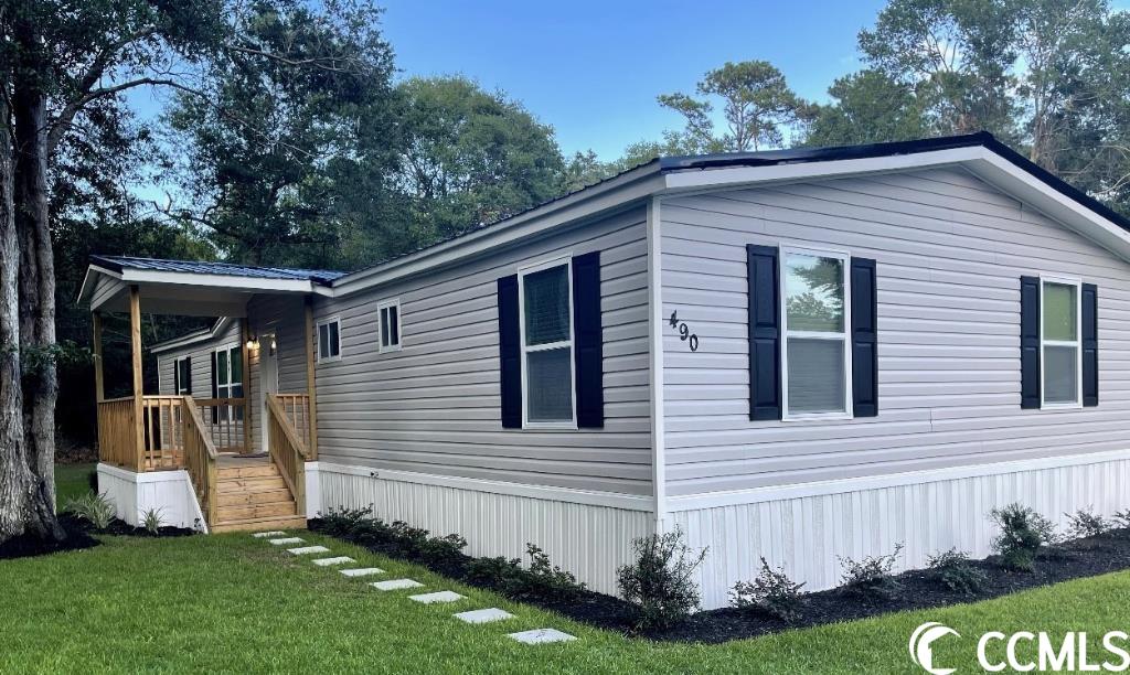 this home is situated in pawleys island, sc., surrounded by lush tress and greenery. just minutes away from some of the best activities, attractions, grocery stores, shops, and schools the area has to offer. the 4-br; 2-1/2ba property is perfect for a first-time growing family.  it also has large laundry room for muti-purpose usage. home have recently been renovated. with structural drywall, waterproof plank flooring/ceramic tile and crown moulding throughout. the home features 4-cozy bedroom with a luxurious en-suite and shared bathrooms with ample space for a large single family. the open concept plan living spaces creates a flow that is both functional and elegant. the modern kitchen is fully equipped with stainless steel appliances, sleek countertops and it is wrapped with stylish shaker cabinet contrasting with cream cupboards. on the outside, the home offers a covered front porch and a rear deck to escape to peaceful yet natural ambiance.