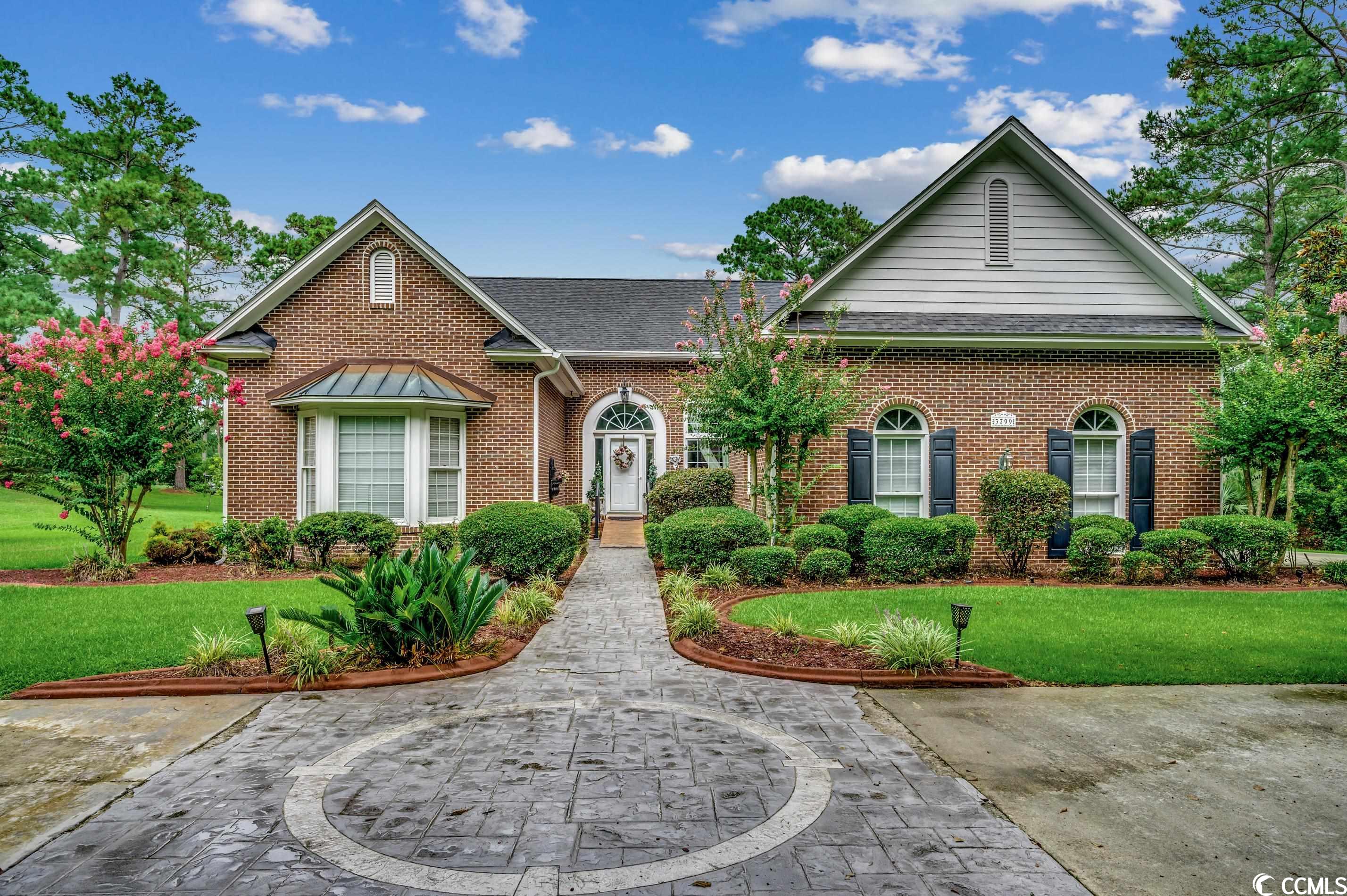 well-maintained eagle nest estates 3-sided brick home on a .74 acre estate sized golf course and lake lot! offering elegant curb appeal and an invitation to gracious living, this beautiful 3 bedroom, 2.5 bath home boasts an additional carolina room and approximately 2842 heated sqft all on one level. no hoa or hoa fees. home has a side-load 2 car garage plus golf cart garage along with a circular drive.  brand new roof installed in dec 2021. this home holds so many opportunities for your own design and updates to create your dream home. upon entry you will find the living room/dining room open floor plan with soaring ceilings and views through to the carolina room and into the backyard.  the carolina rooms has tiled floors, ceiling fan and 2 skylights. the family room and eat-in kitchen have engineered hardwood floors.  the family room has a vaulted ceiling, a gas log fireplace, a wet bar with mini fridge, and built in cabinets. features of the kitchen include granite countertops with undermount sink, white cabinets, jenn-air stove top, wall oven and microwave, stainless steel refrigerator and dishwasher, pantry, breakfast nook and bar. powder room is just down the hall from the kitchen along with a large laundry room with cabinets, mud sink, side by side washer and dryer, and a refrigerator. there is attic access in the hallway leading to plenty of attic storage above. owners suite includes a vaulted ceiling in the bedroom with 2 closets and a bay window providing nice views of the lake and golf course. the owners suite’s bathroom has a double vanity, huge soaking tub, separate shower, private water closet, and a large walk-in closet. all bedrooms have ceilings fans and carpet. both guest bedrooms are nicely sized…one with a tray ceiling and the other with a bay window. the guest bathroom has a double sink and garden tub/shower combo with a transom window above. the back deck offers plenty of room to sit and relax and enjoy the incredible views of the lake and golf course. garage measures 23'7x22'. other outdoor features include an irrigation system and a storage shed. home has public water, sewer (new sewer pump installed in may 2023), and tankless rinnai water heater run off propane. home is 3 sides brick and hardie plank style siding in the back. come see this stately home with strong bones, plenty of sunlight, and a wealth of opportunities for you to create your dream home in the eagle nest golf estates subdivision in little river. live outside the city limits with an easy and quick ride to the sandy shores of the atlantic ocean, and some of the area’s finest shopping, dining, entertainment and more!