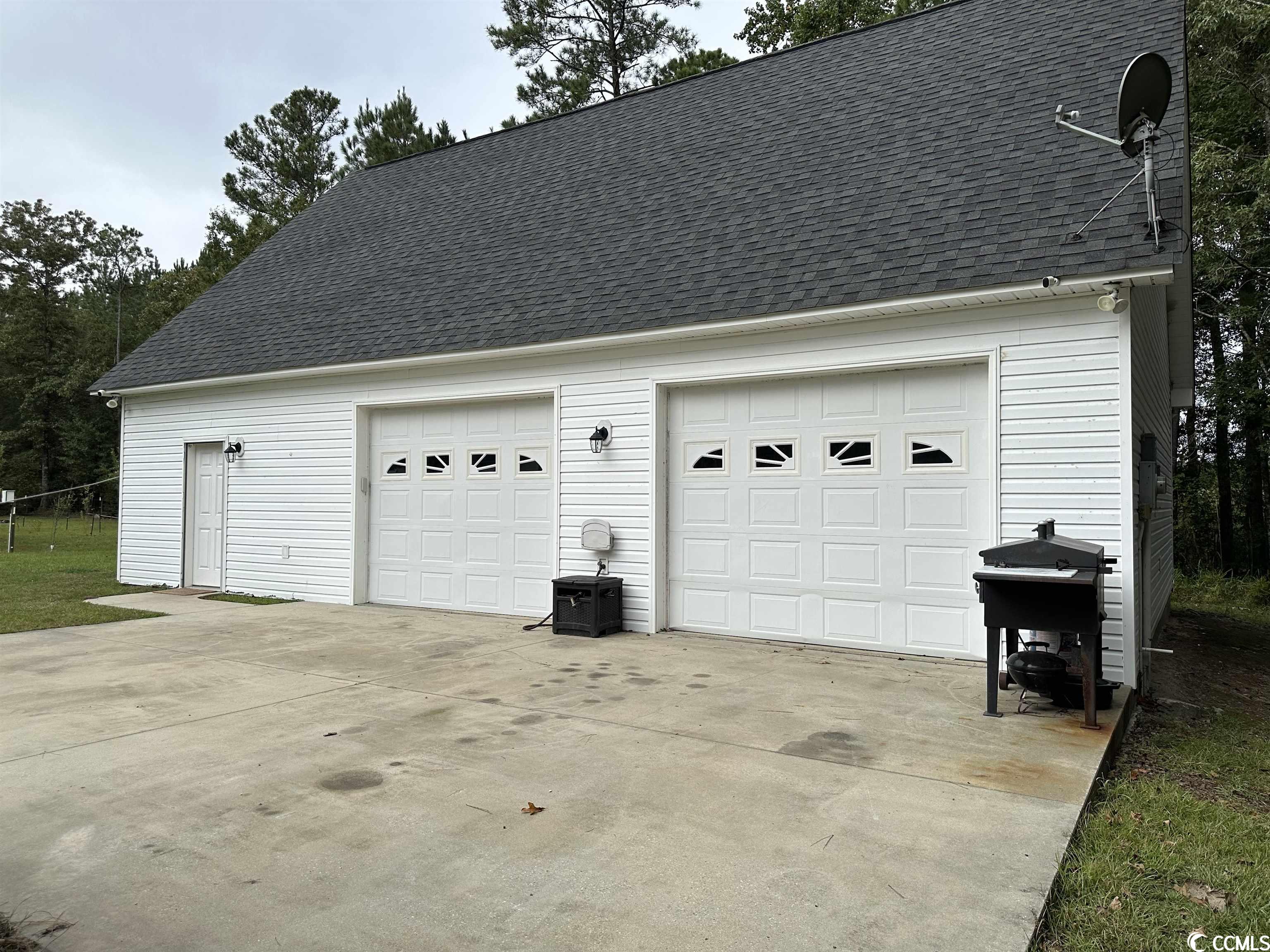 garage with apartment in willie town area of black river. on .69 acres, this property is on apache drive, just across the street from black river, with neighborhood access to a private boat landing. situated at the rear of the lot, the building has 2 garage bays. downstairs is a kitchen and bathroom. upstairs, there is a bedroom with a large flex space - currently used as a studio-style living room/bedroom. this is a turn key property for someone looking for a place at black river. with the option to build at the front of lot, the possibilities are endless!