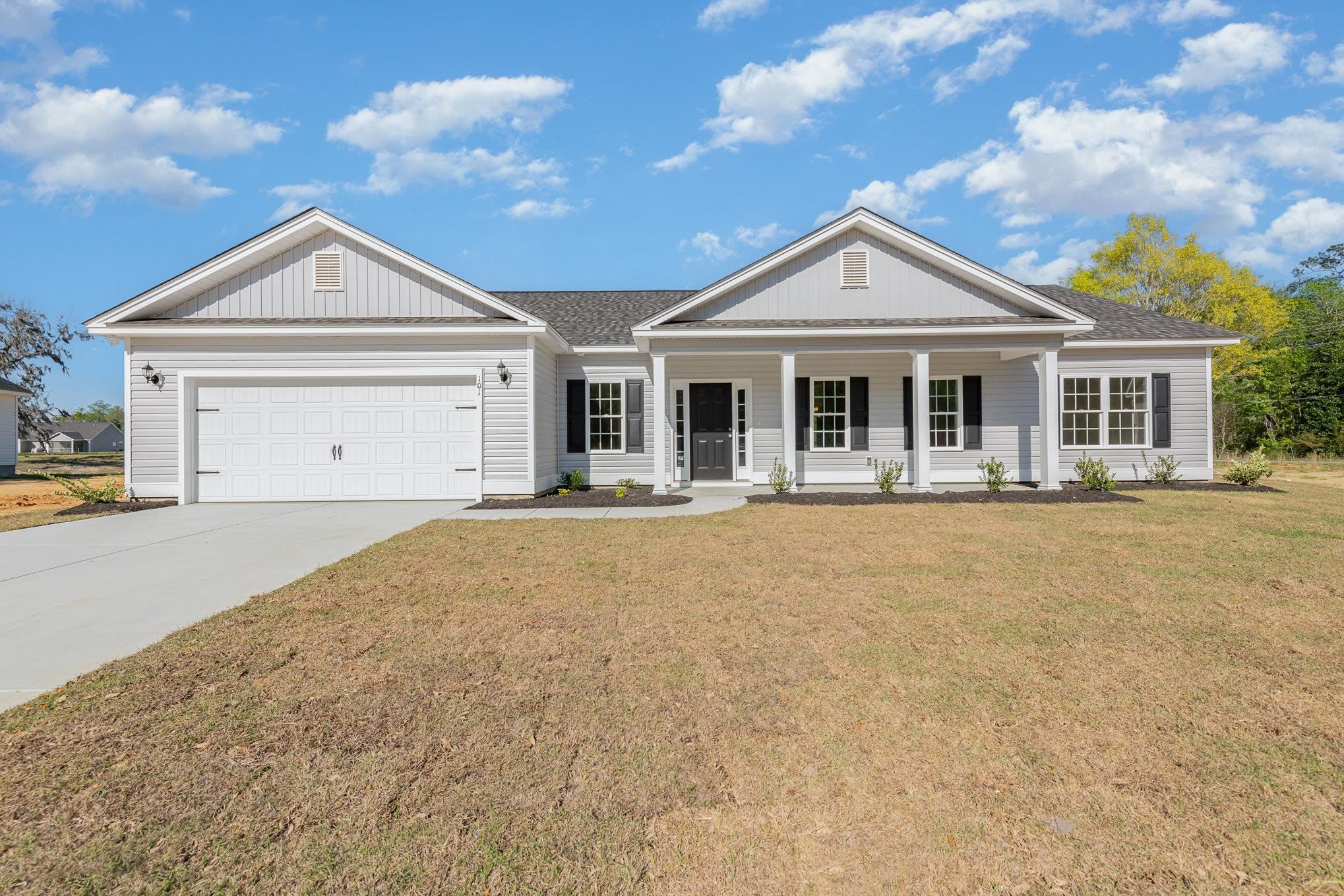 this beautiful ashley plan is an open floor plan and features beautifully vaulted ceilings in the living room, covered porch off of the dining/kitchen area, stunning granite kitchen countertops, upgraded shaker style kitchen cabinets, upgraded luxury vinyl plank flooring in the main living areas and primary bedroom and bath, tray ceiling in the primary bedroom and a walk-in shower in the primary bath and so much more!  peru plantation is a premier neighborhood located in historic georgetown, sc.  peru plantation is on 173 acres of absolutely stunning grounds with rich history and majestic oak trees. building lifestyles for over 35 years, we remain the premier homebuilder of new residential communities and custom homes in the grand strand and surrounding areas.  we are three-time winners of the best home builder award from wmbf news best of the grand strand.  in 2023, we were also voted best residential real estate developer in the myrtle beach herald readers' choice awards and best home builder in the sun news best of the beach contest.  we began and we remain in the grand strand, and we want you to experience the local pride we build today and every day in horry and georgetown counties.  we are dedicated to excellent craftsmanship and customer service and each home is built with pride.  each home here in peru plantation will be adorned with low country charming front porches, brick accents, fully finished and painted two car garages and back covered porches that will be great for entertaining out of doors.  make an appointment to see this fabulous house and make it your very own!  please note:  photos are of a completed home of the same/similar floor plan, for informational purposes only, since the listed home is currently to be built.  the actual home may have different features, upgrades and colors that the photos shown in the listing.