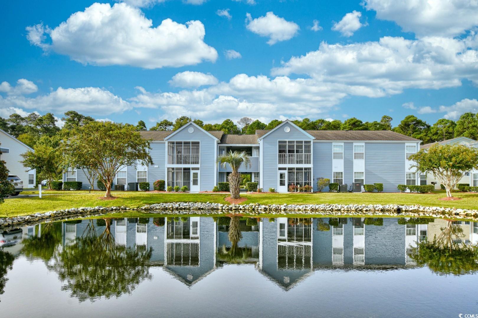 welcome to 8862 duckview dr. unit e, located just east of bypass 17 in south bay lakes. this spacious 3-bedroom, 2-bathroom condo is the epitome of convenience, comfort, and coastal charm. end unit and no upstairs neighbors! as you enter the condo you will notice the abundance of natural light, fresh paint, and the brand new laminate flooring run throughout the entire unit. the kitchen features a refrigerator, oven, microwave, dishwasher, and dining area. step out onto your screened-in porch, which has new flooring and screens, and enjoy the views of the pond. embrace the coastal lifestyle with quick access to the beach, shopping, and dining options. your favorite beach activities, restaurants, and plenty of stores are just a short ride away. a dedicated laundry room and attached storage on the porch provide added convenience and functionality. south bay lakes offers outdoor pools for refreshing swims and a dock area on the pond, perfect for entertaining or simply enjoying the water. don't miss this opportunity to own a piece of paradise in surfside beach. experience coastal living at its finest and make this charming condo your new home! square footage is approximate and not guaranteed. buyer responsible for verification.