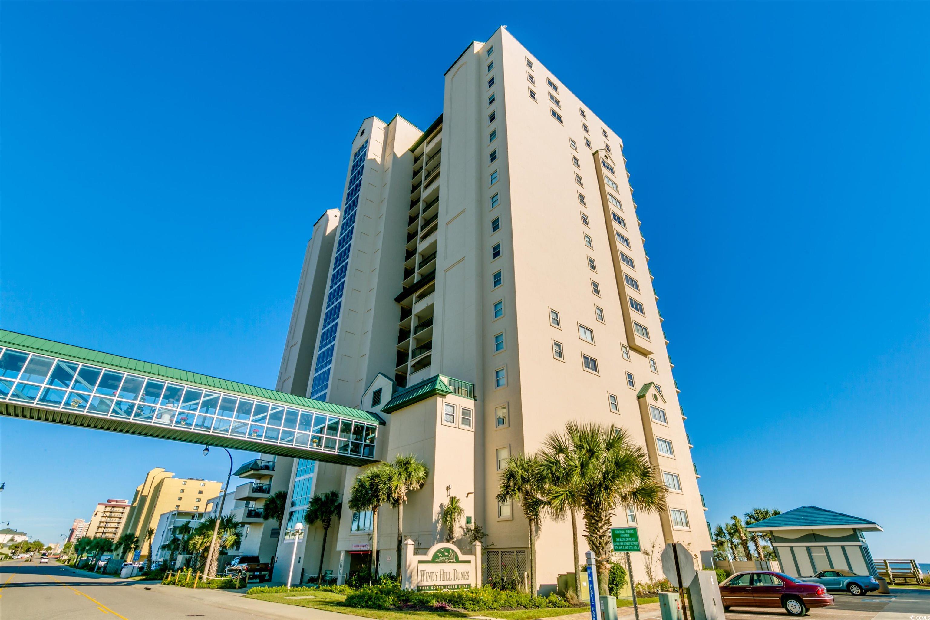 luxurious double unit with over 3000 heated/cooled square ft on the 16th floor with amazing oceanfront, north and south coastline views up on down the beach. this top notch, beautifully furnished, end unit with lots of natural light, 5 bedroom, 4 bathroom condo in windy hill dunes has so much to offer including an enormous balcony, open floor plan, large bedrooms, tile flooring, separate den and living room both with views, oceanfront dining area, built-ins, laundry room with cabinets, high end blinds, granite countertops in kitchens and baths, upgraded cabinetry, tile backsplash, stainless steel appliances, wine cooler, wet bar, extra-large primary suite with two walk in closets, double sinks, separate jetted tub and walk in shower, upgraded fixtures and toilets, and secondary bedrooms have walk-in closets. this amazing unit is a great building with a pool, lazy river and outdoor grill area.