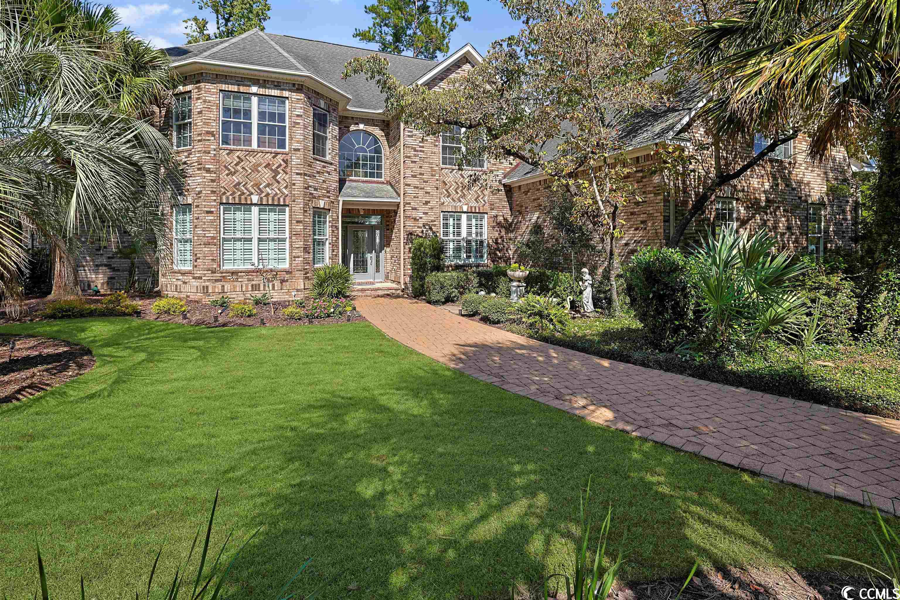 welcome to the prestigious creek harbour at prince creek neighborhood, where luxury meets comfort in this remarkable 5-bedroom, 5.5-bath, all-brick custom-built home. with a gated entrance ensuring privacy, this magnificent property boasts a host of high quality features that are sure to impress. step inside this open concept floor plan home and be greeted by the stylish lvp flooring, complemented by soaring ceilings and transom windows that flood the space with natural light. the attention to detail is evident throughout, with exquisite boxed chair railing, crown moulding, and recessed lighting enhancing the overall ambiance. indulge in the convenience of a wet bar and the charm of french doors and arched entryways, while cozying up by the fireplace with gas logs in the inviting living area. get your work done in the private office, which also offers a murphy bed, accommodating extra guests overnights or those who may have trouble with stairs. host unforgettable dinners in the graceful formal dining room. the kitchen is a chef's dream, featuring a breakfast bar, a sleek stainless steel with black glass appliance package, a smooth flat cooktop, dual wall ovens, a built-in microwave, and a french door refrigerator with an ice and water door dispenser along with a middle drawer with controllable temperature. the ample granite countertops provide space for meal preparation, and a convenient computer niche adds functionality. the adjacent breakfast nook is the perfect spot to start your day. the first-floor master bedroom is a true retreat, with a two-step tray ceiling and fan adding a touch of elegance. the master bath offers an arched entryway, complete with two sinks featuring dual vanities, a walk-in shower, a double slipper cast iron pedestal tub for ultimate relaxation, surrounded by a cathedral ceiling, wall to wall tile, and designed to create a spa like feel, and also a versatile walk-in closet. upstairs, you’ll discover more bedrooms, three having their own full bath and providing a private sanctuary for family members or guests, as well as an extra spacious fourth bedroom with two walk in closets. the upstairs also features an additional full bath, an inviting and versatile loft area, and a laundry room. this captivating home is equipped with modern conveniences, including a central vacuum system. take advantage of the two screened porches and relax on the delightful back patio, ideal for enjoying the outdoors. the three-car side load attached garage ensures ample parking and storage space. don't miss the opportunity to own this stunning residence that effortlessly combines sophistication and comfort. experience the epitome of luxurious living in this exclusive creek harbour at prince creek community. this home offers you easy access to the beach as well as direct access to the intracoastal waterway via its community dock, which sits on collins creek. enjoy the serenity of nature at its finest as you travel by boat to the open waters of the waccamaw river. golfing and all of the other activities and events in myrtle beach and murrells inlet are also nearby, including fun eateries, award winning off-broadway shows, public fishing piers, marsh walk, and intriguing shopping adventures along the grand strand. conveniently located to your everyday needs, including grocery stores, banks, post offices, medical centers, doctors’ offices, and pharmacies. check out our state of the art 3-d virtual tour.