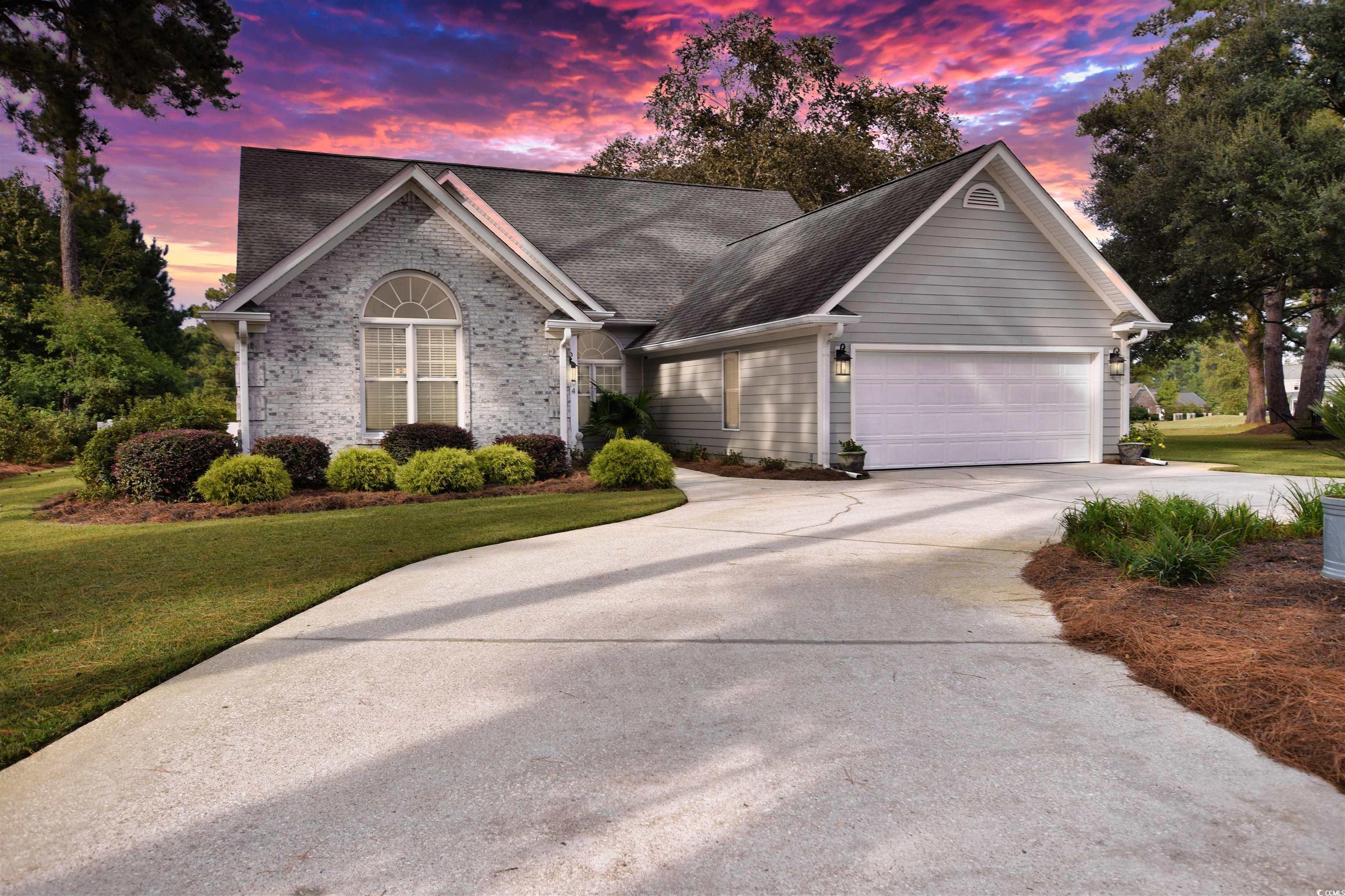 on the golf course with a private pool in wedgefield plantation - welcome to an elegant 3-bedroom, 3-bathroom sanctuary, where modern refinement meets functionality. on the first floor, two spacious suites each offer their private baths, with the primary suite boasting a luxurious jetted tub and walk-in shower. natural light dances through the open-concept layout, enhanced by vaulted ceilings, skylights, and a heartwarming dual-sided fireplace. the living, dining, and sunroom areas seamlessly converge, leading to a 2020-updated kitchen adorned with quartz countertops and state-of-the-art stainless appliances. the richness of hickory hardwood on the first floor gives way to the cozy carpeted loft-bedroom on the second, currently serving as a tranquil office retreat. --------- stepping outdoors, the crown jewel awaits: a majestic 16x32 in-ground pool. protected within a grand screen enclosure, its surrounding deck promises safety and relaxation, especially beneath the retractable shade awning. a picturesque circular driveway winds its way past mature, blossoming gardens. additional perks include easy-to-clean tilt windows, ambient light dimmers, a roomy two-car garage with an adjoining heated/cooled workshop, efficient lawn irrigation, and dual hvac systems. nestled against the backdrop of the scenic #2-hole green, this home is a harmonious blend of luxury and peace.
