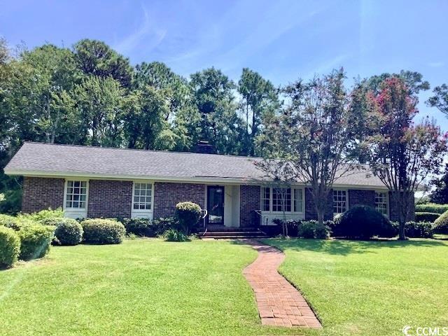 located in the sought-after north end of the city of myrtle beach, in an established neighborhood that has sidewalk access to the beach. this timeless single story, three bedroom two bath brick home features wide planked hardwood flooring, masonry fireplace, wood cabinetry and recessed lighting. the 14 x 28 kitchen family room is adjacent to a window-lined carolina room, integrating the outdoors into the activity hub of the home. an additional front living area provides a retreat from daily activities making it the perfect office library or study. a large laundry room doubles as a multi-purpose space. hall and primary bath host original white tile walls, shower and cast iron tub, while floors and most fixtures have been replaced. throughout the home you will find solid wood raised panel doors, some two-piece door and window trim, chair rail, crown molding, two cedar lined closets, an additional linen closet and true divided light windows. casement windows for the carolina room are upfitted with screens and lined bali wood shades. an attached two car garage and concrete drive provides ample parking. situated on an approximate .36 acre corner lot, framed by mature magnolia, azaleas, camellias, crepe myrtles and a lush st. augustine lawn complete with a two-zone irrigation system on a well. brick sidewalks and some fencing complete this oh-so-close to the beach home. new roof 2018. new hvac 2019. new well motor 2020. convenient to all myrtle beach has to offer, beach, golf, dining, shopping, marina, ymca, bark park, bike/walking trails, fishing pier, schools, hospital, airport and area attractions. no hoa fees. square footage is approximate and not guaranteed. buyer is responsible for verification. seller is licensed sc real estate agent.