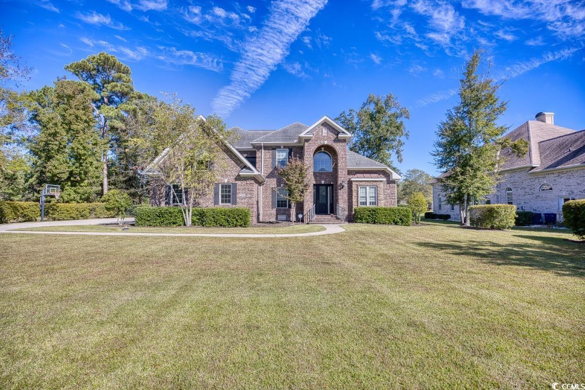 quality, quality, quality. this gorgeous home is located in the dye estates of barefoot resort. the neighborhood has 24 hour guarded access. every room has been updated to emphasize the exceptional design of this all brick home. the front door welcomes you into a grand foyer with a game table space that can also be used for formal dining. the room expands into the den with beam ceilings and an exquisite chandelier. the built in bookcases and gas fireplace bring warmth and charm into the space. the master suite is off the living room and expands from the front of the home all the way to the back. from the tray ceilings, custom walk in closet, and rain head shower, no detail is left untouched in this suite. back in the living area, the breakfast bar invites you into the eat in kitchen with large windows and tons of natural light. the kitchen itself is flawless with stainless steel appliances, a work island and granite countertops. the backsplash is unique yet timeless. the large laundry room is located right off the two-car garage and has an abundance of workable space. a bedroom is located off the kitchen with a private bathroom and the four seasons room is on the back of the home. the patio invites you into the yard with a pool and outdoor fireplace that overlooks the pond. in the upstairs of the home is a spacious den, two traditional bedrooms and baths, and a flex space that is being used as a fifth bedroom. don't miss the possibilities that this home offers. schedule your showing and call this place home, today!