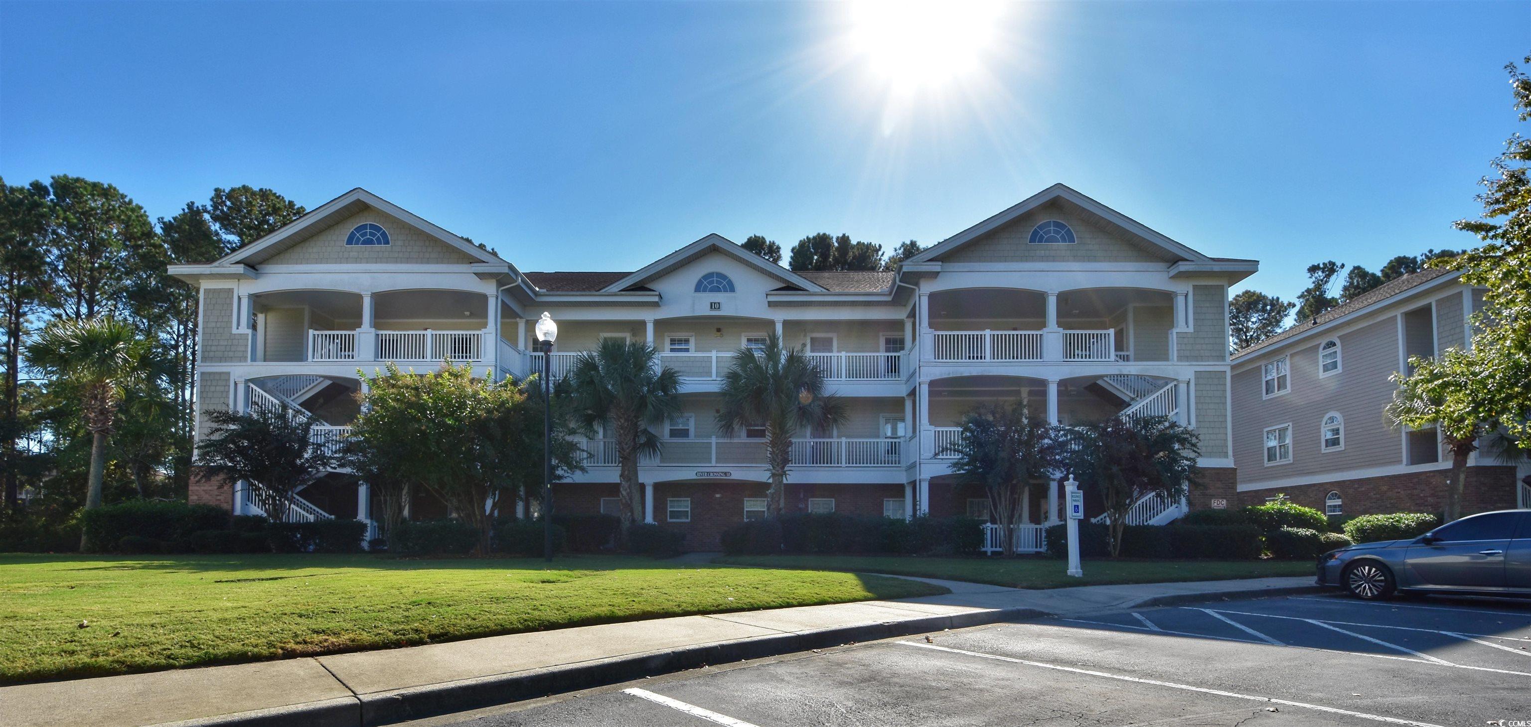 you will love this beautiful top floor 2-bedroom unit in prestigious barefoot resorts only gated golf villa community river crossing. the unit offers 1000 heated square feet and the best part it comes completely furnished down to the pots and pans. all you need are your personal items to move in. with the unit being on the top floor you do not have to worry about hearing anyone above you while enjoying the vaulted ceilings. the kitchen has ample cabinets and countertops that looks into the dining and living room combination. just off the living room is a large, screened porch overing looking the norman golf course. a perfect place to entertain your friends and family or just to have your favorite cocktail. the master bedrooms is large with a tray ceiling and windows overlooking the golf course as well. the owners have replaced carpeting with beautiful lvp flooring and replaced some of the lighting.  barefoot resort is like none other offering 4 championship golf courses, 4 onsite restaurants, a 15,000-waterway pool, marina, and the crown jewel all owners have use of the new barefoot beach cabana with private access and parking. the hoa dues are one of the best on the beach for the money. it includes insurance on the building, wireless internet, basic cable, water and sewerage, trash pickup, maintenance on the building, and landscaping. no other resorts offers so much.