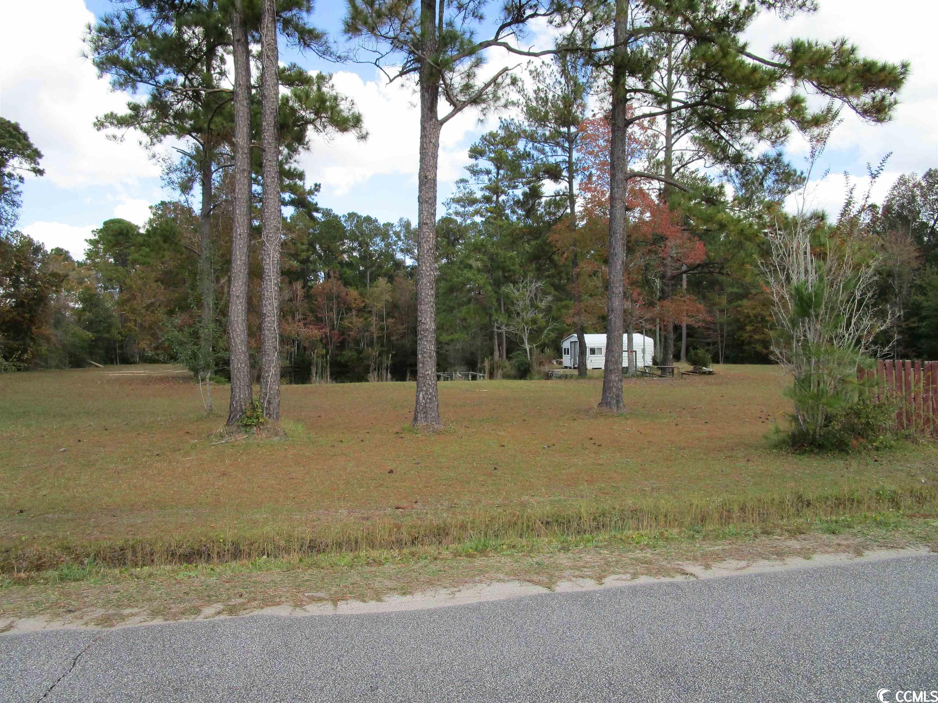 just list 4.15 acres of partially cleared land with the main section that is totatlly cleared and ready for you to build with a view of the pond on three sides. if you are looking for quiet country living with no hoa with room for you to spread out and have room for additional out buildings for storage work space this is it. corner lot that is located on paved road with all available utilities ready for you to connect. electric is on site and power is inside of the small out building. schedule your showing today. property is owned by agent and family member.