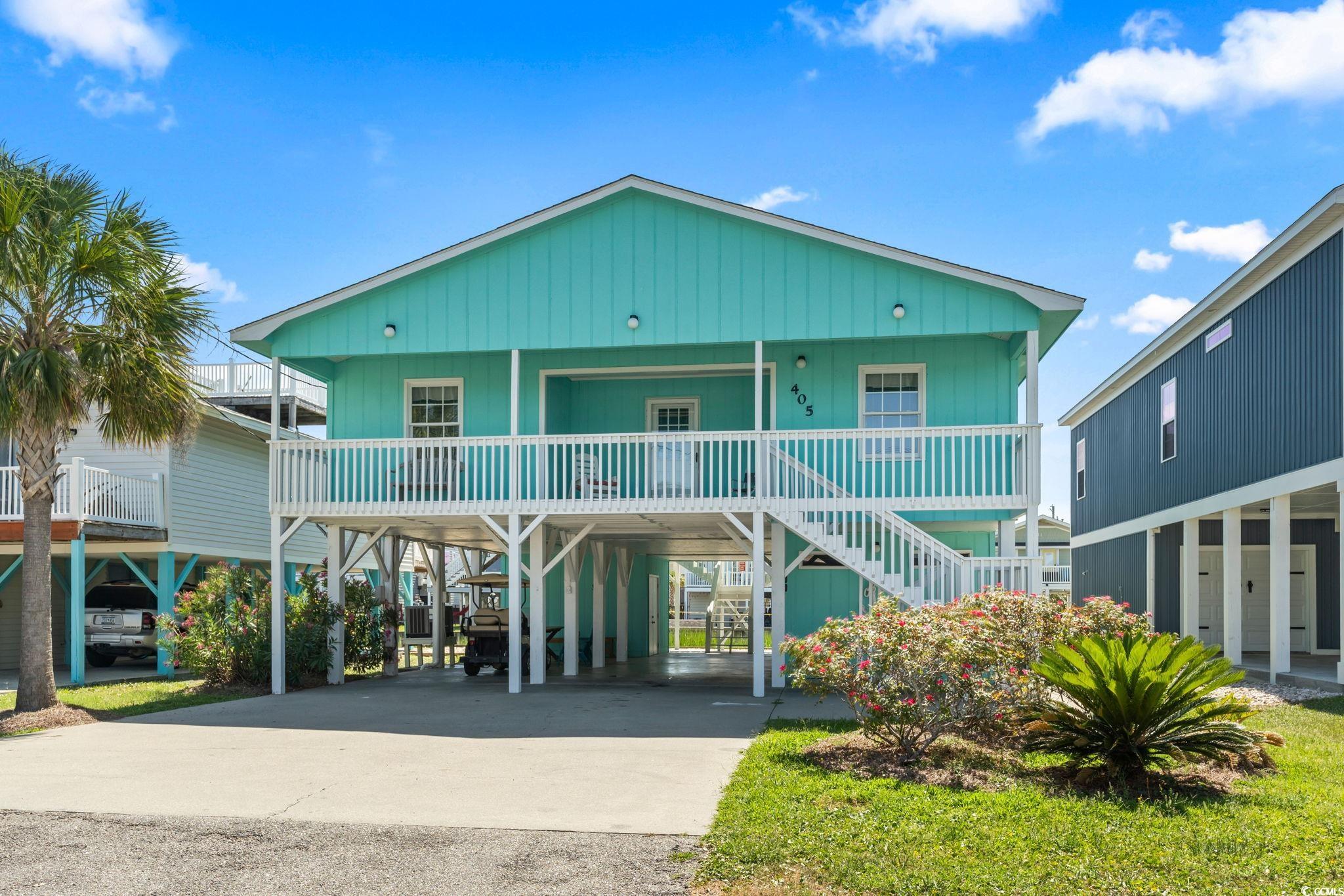 welcome to your dream beach retreat in cherry grove beach! this stunning raised beach house located on the channel in cherry grove offers the perfect blend of comfort, style, and waterfront living. with 4 bedrooms and 3 bathrooms, this fully furnished home is an ideal oasis for families and vacationers alike. as you step inside, you'll be greeted by the inviting ambiance of high engineered white oak clear hardwood flooring that flows seamlessly through the updated kitchen. the kitchen is a culinary delight, featuring a 12-foot countertop, a convenient dry bar, and not one, but two microwaves – perfect for catering to large families or rental guests. the thoughtful redesign of the kitchen and dining area creates a spacious and open layout, providing the perfect setting for entertaining friends and family. the updated kitchen also boasts modern appliances and a chic design that enhances the overall aesthetic of the home. enjoy the beauty of cherry grove beach from the comfort of your own home, thanks to the new bulkhead installed just 3 years ago. take advantage of the waterfront location by accessing the marsh via boat – a unique feature that adds to the charm of this coastal gem. this beach house is not only aesthetically pleasing but also structurally sound, with a new roof in 2020, a brand new hvac system installed in 2022 and new washer and dryer. the downstairs bedroom is equipped with its own heat and air unit for personalized comfort. the attention to detail extends to the interior, with updated cinnabar oak laminate wood flooring throughout the living and bedroom spaces. the bathrooms and foyer feature stylish del conca rialto white porcelain tile, adding a touch of elegance to these spaces. the lower level of the house is a versatile space, with a private fourth bedroom that includes wainscoting and high engineered white oak clear hardwood flooring. additionally, the 11x7 storage and workroom is perfect for diy enthusiasts, featuring a wall of floor-to-ceiling pegboard for tools. the 11x8 laundry room has been recently painted for a fresh and clean feel. step outside onto the double decks and indulge in relaxation with three wooden swings to lounge in. the 14x11 deck overlooking the channel provides breathtaking views, creating the perfect backdrop for enjoying sunsets and coastal breezes. this beach house is not just a home; it's a lifestyle. immerse yourself in the tranquility of waterfront living, updated amenities, and thoughtful design. don't miss the opportunity to make this cherry grove beach retreat your own!