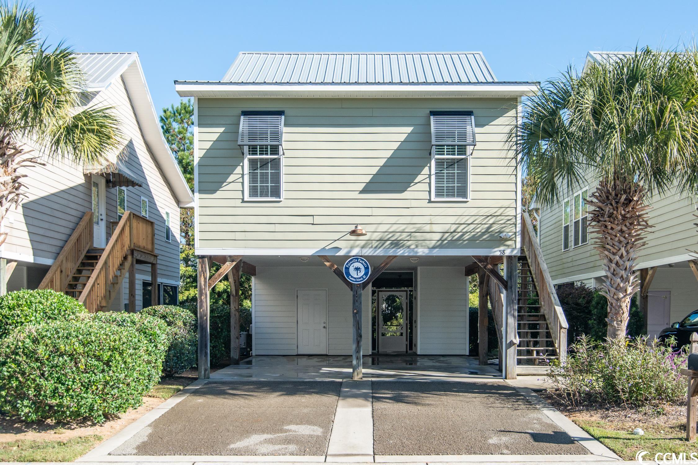 this is your opportunity to own a piece of paradise.  this home offers 2 bedrooms and two full baths with an open concept living space.  the large screened in porch is perfect for group gatherings and cookouts.  centrally located near pawleys island  and litchfield beaches this adorable raised beach style  house is waiting for you to start making memories.  58 weatherboard is nestled between the atlantic ocean and the waccamaw river.  your days can be well spent golfing, boating, shopping or enjoying the beach.  pawleys island offers numerous dining options from casual to fine dining.  enjoy a day trip to historic georgetown and the harbor walk immersing yourself in the rich history of the third oldest city in  sc.    charleston is 70 miles south and the drive offers lovely scenic views of the lowcountry marshland.  if 58 weatherboard is to be used as a vacation home you can fly in and out with ease from the myrtle beach international airport.  what are you waiting for?