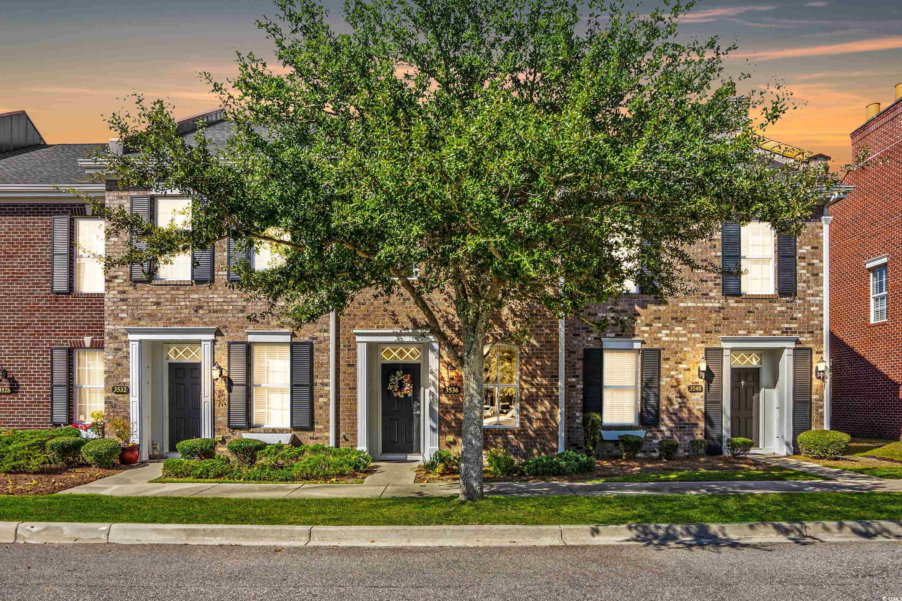 exceptional townhome one mile to the beach! welcome to st. james square, a prime myrtle beach townhome community. this stately 2-bedroom, 2.5-bathroom residence welcomes you with its rich brick exterior and mature landscaping. upon entering, the spacious open living and dining area bathes in natural light, thanks to an abundance of windows. the well-appointed kitchen is a standout feature, boasting a granite island with a breakfast bar, stainless appliances, and a substantial pantry. adjacent to the kitchen, you'll find a separate laundry closet and a convenient half bath for guests. venture upstairs to discover two generously sized bedrooms, each thoughtfully designed with ceiling fans, private en-suite bathrooms, and ample closet space. the fenced courtyard offers a private outdoor oasis, perfect for entertaining guests or unwinding after a day at the beach. additional storage space is abundant with a private garage and a pull-down attic. st. james square's central location in myrtle beach puts you within easy reach of shopping, dining, entertainment, and the beautiful beach. no matter where your plans take you, you'll be there in just minutes. this is the effortless lifestyle you’re looking for while sacrificing nothing. a must see!