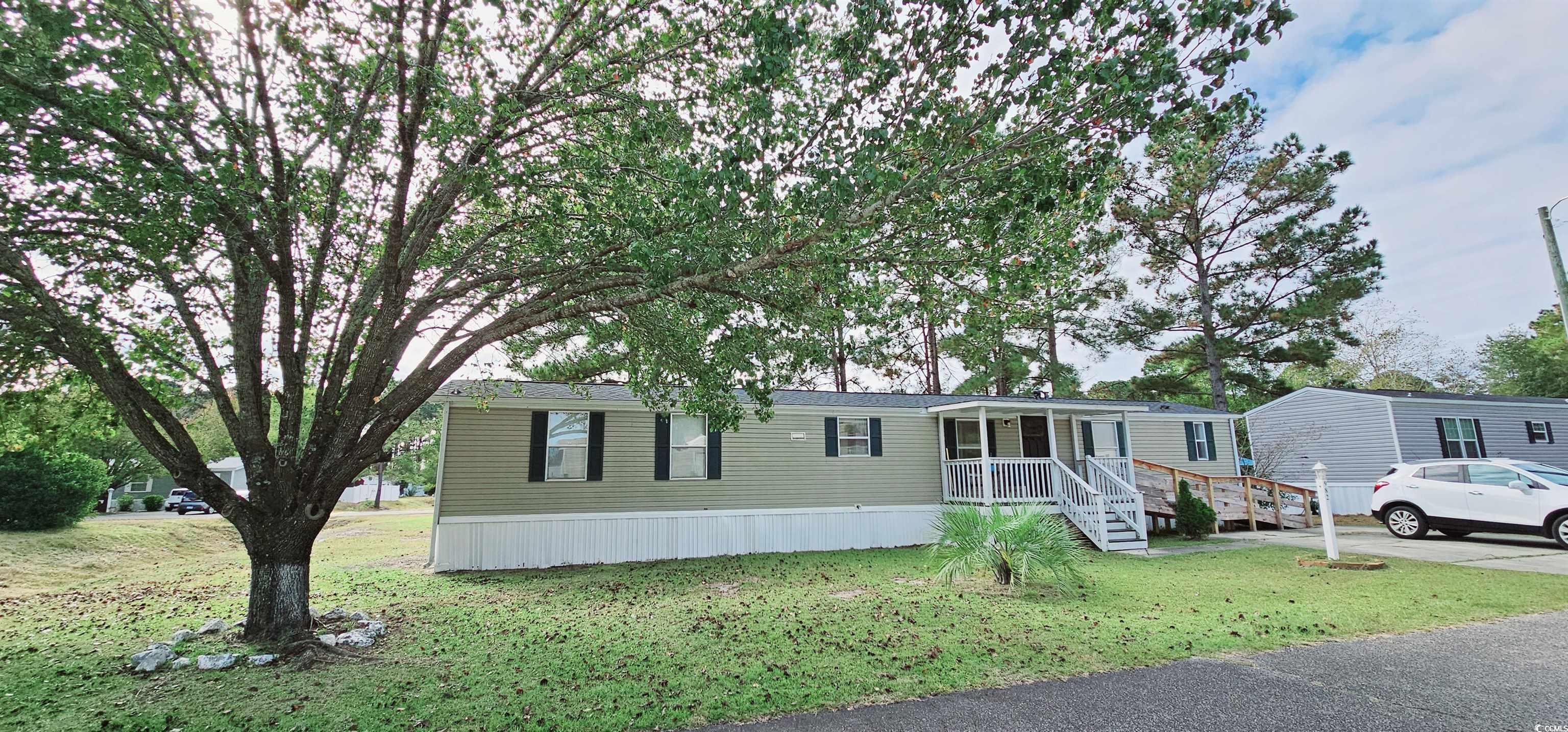 nestled in a serene neighborhood with mature trees, this 3-bed, 2-bath home offers peace and convenience. located near coastal carolina university and the horry/georgetown technical college, it provides easy access to education. it is also convenient to downtown conway and myrtle beach. enjoy community amenities like a pool, playground, and clubhouse. inside, discover modern vinyl plank flooring, cathedral ceiling, and walk-in showers in a well-designed split floor plan. close to shopping centers, this home blends comfort, community, and accessibility for a harmonious lifestyle.