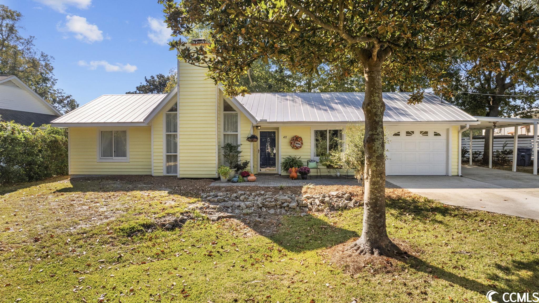 this charming 3-bedroom, 2-bathroom home is located in the coveted golden mile area of myrtle beach, just a block and a half from the beautiful blue atlantic. as you step inside, you'll be greeted by a bright and open floor plan that creates a spacious and inviting atmosphere. the living and dining area features stunning vaulted ceilings and elegant bamboo wood flooring, providing a sense of style and character. in the living room, a wood-burning fireplace is ready to keep you cozy during chilly evenings. the kitchen is equally impressive with corian countertops, plenty of workspace, and ample cabinetry to meet all your culinary needs. outside, a deck and patio area, accessible from the dining area, provide a perfect space for both entertainment and relaxation. a privacy fence surrounds the yard, and a practical shed is available for storing your gardening tools. convenience is key here, with ample parking space, including a turnaround, in the front of the house. you'll also find a heated garage and a carport for all your parking needs.  this property offers a wonderful opportunity to embrace the beach lifestyle, with easy access to the shore and a charming, well-maintained home. all measurements are approximate and should be verified by buyer.