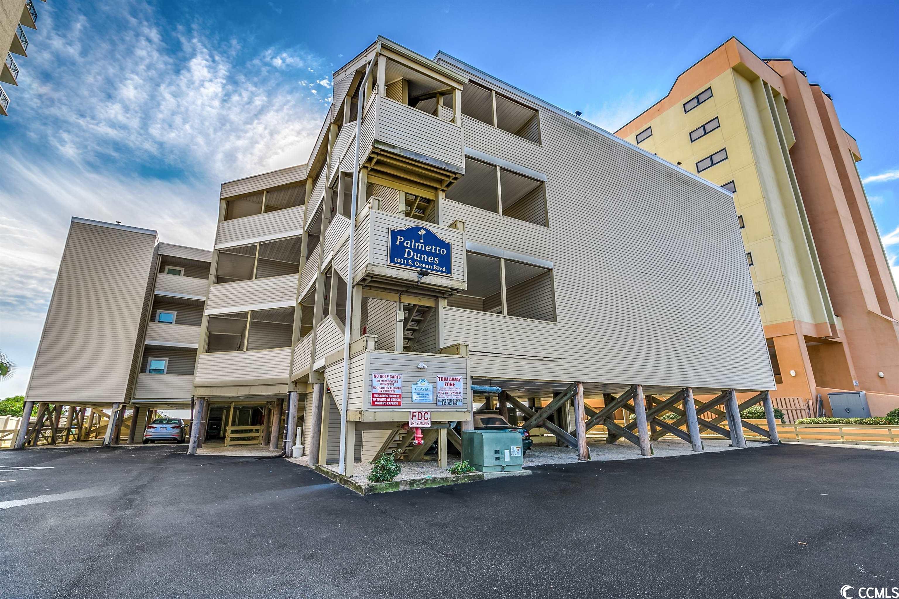wow! check out this awesome two bedroom, two bathroom, direct oceanfront, nicely updated and upgraded unit at palmetto dunes in north myrtle beach with shopping, restaurants and entertainment nearby. this unit has been completely remodeled from top to bottom. interior features include luxury vinyl throughout, smooth ceilings, an oceanfront master bedroom,renovated bathrooms, solid surface countertops, all new furniture and fixtures. enjoy amazing oceanfront views from many points inside the unit as well as outside on your oversized balcony. this unit has phenomenal rental history and is ideal for an investment or second home. take advantage of this fantastic opportunity to own the perfect beach getaway.
