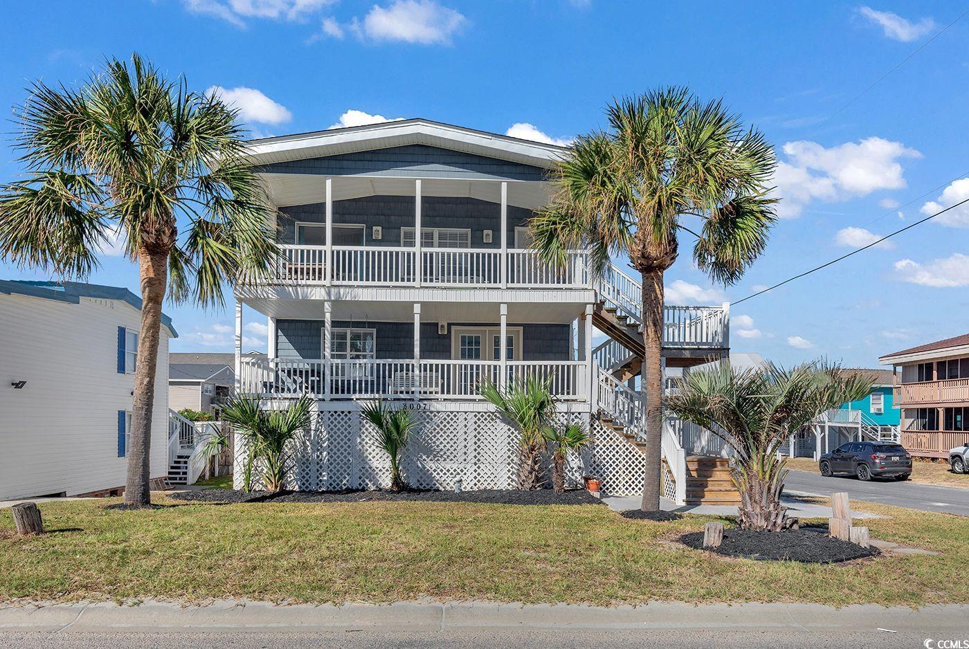 location is key.  second row raised beach cottage in the cherry grove section of north myrtle beach.  the beach access is just across the street and the home is within walking distance to the pier and boulineaus iga and all the attractions on the main street in cherry grove! close to shops restaurants and beach bars!! come and get your cherry grove on today!  this 7 bedroom home has 2 floors one with 3 bedrooms and the other with 4  bedrooms connected by an interior set of stairs. there are two sitting/tv areas while the second floor features the full kitchen.  there are two large front porches both have views of the ocean. located on the ground floor there is a huge storage space with an additional 500+ square feet that includes the full size washer and dryer and tons of storage.  look at this for your investment buyers as the rental potential is there or for someone looking for a cherry grove second home