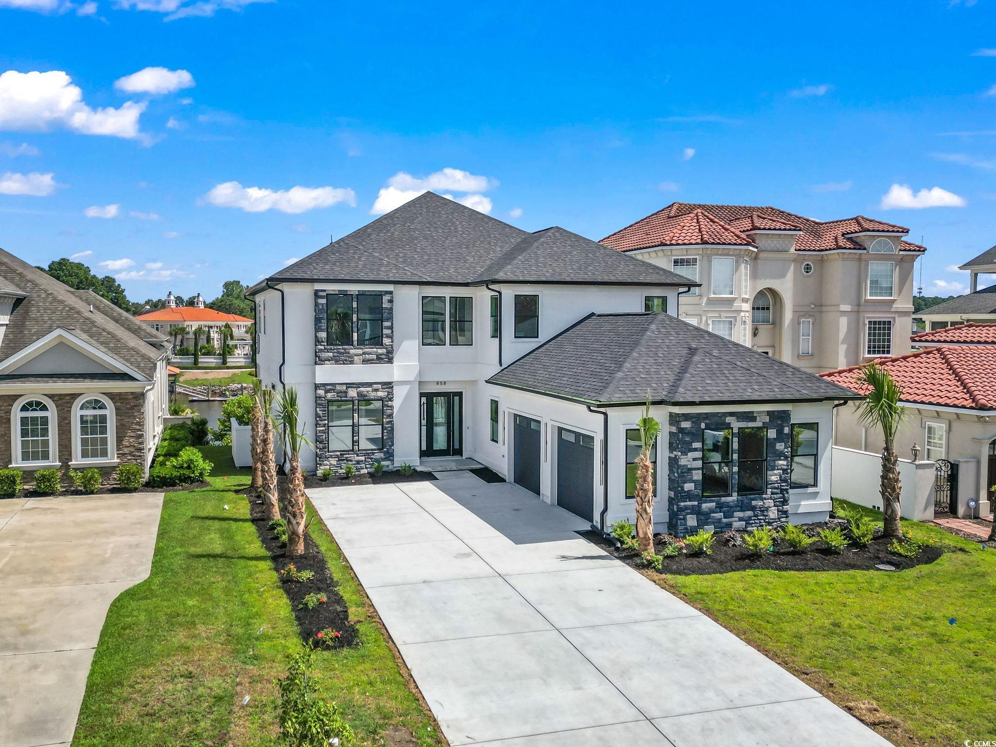 this stunning new construction home boasts 5 bedrooms and 4.5 baths, with breathtaking views of the intracoastal waterway. at the time of listing, the only icw-front home for sale in carolina waterway plantation. enjoy luxurious living in this spacious and modern home, complete with high-end finishes and top-of-the-line z-line appliances. the open-concept living space is perfect for entertaining guests, while the private bedrooms offer a peaceful retreat. relax on the expansive back patio and balcony to take in the stunning water views. with direct access to the icw, this home is perfect for boating enthusiasts. the master suite is a true oasis, with a spa-like bathroom and a private balcony overlooking the water. the other four bedrooms are equally spacious and well-appointed, with plenty of room for guests or family members. the home also features a fully-equipped gourmet kitchen and a cozy living room with a fireplace. this home is the perfect place to  enjoy all that myrtle beach has to offer, from the nearby golf courses and shopping centers to the beautiful beaches and water activities. you'll love the convenience of living on the water, with easy access to boating, fishing, and other water sports. and with the many restaurants and entertainment options in the area, you'll never runout of things to do. don't miss out on this incredible opportunity to live in the lap of luxury on the water.