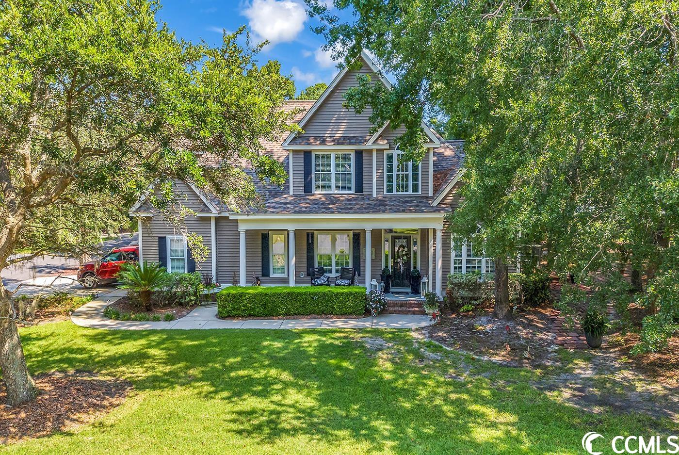 charming 4-5 bedroom home located in ricefields! the eclectic, artsy nature of this custom home is highlighted by traditional, high end appointments: hardwood floors, crown molding, tile and granite. entering from the lowcountry style front porch, the welcoming foyer enjoys abundant light from the large transom window. to the left is the formal dining room, (currently used as an office) to the right is the main floor guest suite. the kitchen, with its stainless steel appliances, abundant, beautiful cabinets, range hood, stone backsplash behind cooktop, wall ovens and wine refrigerator is open to the breakfast room with window seat and the large living room boasting a soaring cathedral ceiling, brick fireplace with raised hearth, and access to the deck... perfect flow for entertaining inside or out! on the other side of the house is the laundry room and the private master suite, featuring vaulted ceiling, walk-in closet, whirlpool tub, large tile shower, and private water closet.  up the beautifully rounded staircase with wrought iron spindles you'll find two bedrooms, a full bath, and a rec room that could easily be made into a 5th bedroom. very convenient to all pawleys island schools, shopping, dining, and medical facilities, ricefields offers its residents a full array of great amenities including a community pool, boat landing access to the waccamaw river/icw, a beautiful nature trail, streetlights, and sidewalks. ricefields...it's a great place to live!