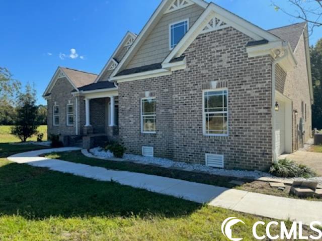this beautful four bedroom with two master suites on main level has plenty of room for everyone.this home has three full baths and two half baths. the main level has fifteen foot ceilings and an openfloor plan that is great for gatherings. there is also an office on the main floor complete with acloset that could be utilized as another bedroom or guest room. right off from the living room is acarolina/sunroom that gives you full view of the pool area. the kitchen has a pantry and sepratelaundry/mud room as well as an island that is great for prep work. there is room to place a breakfastdining area in the kithen and seating at the bar. this home offers privacy with a beautiful countrysetting within minutes of shopping and dining. this home has been encapsilated under the home and hasnew appliances.  you don't want to miss out on this stunning home