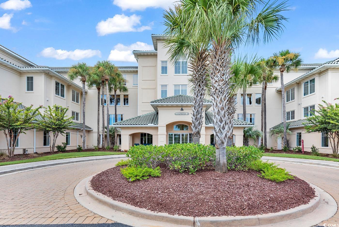 ground level - private golf course view - nestled within the prestigious gated edgewater community of barefoot landing, this stunningly custom remodeled condo emerges as a gem. upon entry, to your left, discover a modernized kitchen with generous storage and a concealed laundry area, elegantly separated by a pocket door. to the right, a delightful dining space, adorned with wainscoting, welcomes you. proceeding forward, you're greeted by an exquisite living room, anchored by a striking fireplace, forming a perfect blend of comfort and elegance. beyond lies a screened porch, offering a serene gateway to the greg norman golf course, a haven for dog enthusiasts.  the condo's interior houses a spacious primary suite featuring dual closets and an expansive bath, complete with twin 4-foot vanities, a capacious shower, and an additional large closet. the second bedroom doesn't fall short, offering substantial space and a walk-in closet. currently serving as an office, the third bedroom adorned with magnificent custom built-ins, transforming work into a joyous endeavor. each bedroom affords a panoramic, unobstructed vista of the golf course, complemented by wooded custom window shutters to ensure privacy.  additional amenities include a private storage unit and designated parking in the garage. edgewater's enviable location on the inter-coastal waterway enhances its allure, with a walking trail by the water, scenic gazebos, a vast pool, a hot tub, a state-of-the-art workout facility, and a community center reserved for edgewater residents and guests.  nearby, barefoot landing entertainment complex, a myrtle beach favorite destination with multiple restaurants, shopping, wine tasting, variety shows and concerts to name a few.  this community also has exclusive beach front access to the barefoot resort community oceanfront cabana, with private parking for owners and/or frequent daily shuttle services to the beach between april - october.  this location is very centrally located in myrtle beach with easy access to hwy 17, 31 and 22.  this home has so many custom features throughout, come and take a look.   will not disappoint.