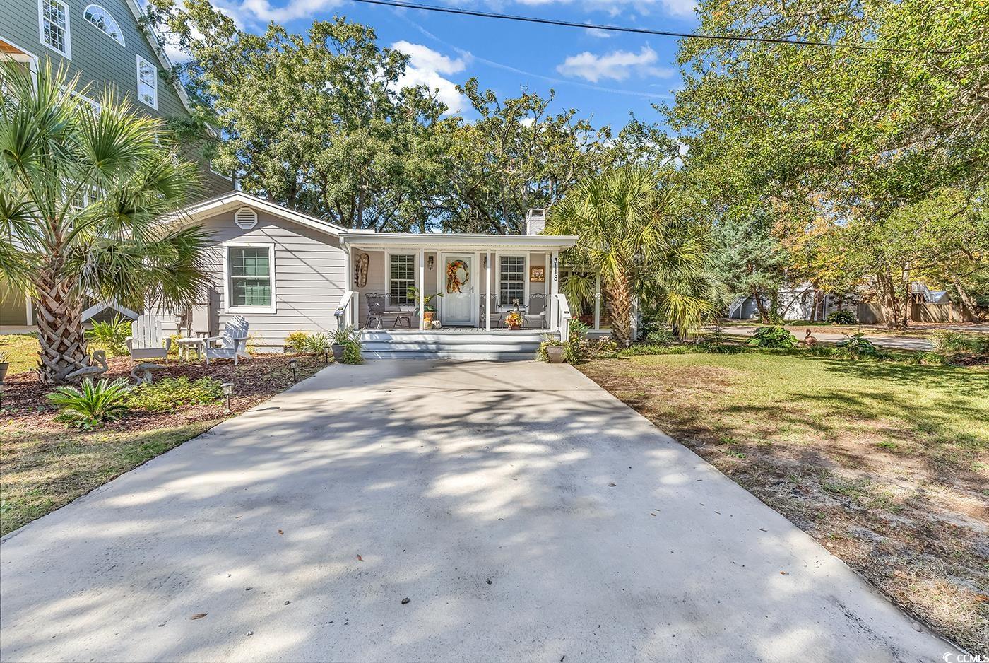 your charming murrells inlet cottage, brimming with character, awaits your presence. recently updated, this property boasts new wiring, a fresh roof, hardie board siding, and an upgraded kitchen. all appliances, including a backup generator, are included with the home. refinished hardwood floors complement various flooring updates throughout. this turnkey gem affords you the luxury of sipping your morning coffee at the inlet's edge. a boat ramp a mere few feet from the front yard welcomes your jon boats, kayaks, and paddle boards. the master bedroom features a closet within the bedroom and a second walk-in closet in the master bath, complete with his and her sides. guest bedrooms also offer ample storage with closets. the bathroom floors and showers, as well as the laundry room, showcase beautiful tile. the home boasts new plumbing and led recessed lighting throughout the entire ceiling. a refinished wood-burning fireplace, currently utilized as an electric fireplace, adds to the cozy ambiance. just minutes from the murrells inlet marsh walk and your favorite inlet restaurants, this home invites you to unwind on the front porch or the rear screened porch. a detached storage building on the property, equipped with power, provides additional convenience. disclaimer: all square footage is approximate and not guaranteed. the buyer is responsible for verification.
