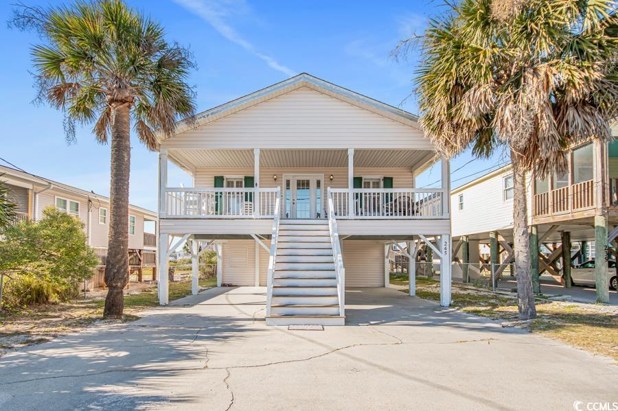 welcome to paradise in garden city, south carolina! this stunning 6-bedroom, 4-bathroom beach house offers the epitome of coastal living with breathtaking ocean views. immerse yourself in the soothing sounds of the waves and the gentle caress of ocean breezes just feet from your front door.  this spacious residence was once a small cottage built in the 1950s but underwent major renovations/addition in the late 1990s. the main living area, located on the second floor, provides ample space for family, friends, or guests. the open-concept living area is flooded with natural light, creating an inviting atmosphere that seamlessly blends with the coastal surroundings.  the coastal-cottage style kitchen is off the dining area and has a large pantry for all of your storage needs. down the hall from the kitchen, you’ll find three full bathrooms, four bedrooms, and a large laundry room. in addition to the bedrooms on the main floor, there are two bedrooms with a shared full bathroom on the lower level.  if you’re searching for additional space to entertain, watch the 4th of july fireworks, or enjoy the salty southern air, the home has a 341 square foot front porch with views of the atlantic ocean. the 341 square foot back porch has gorgeous sunset views peeking over the tidal creek and into murrells inlet.  rinse off after a beautiful beach day in the outdoor shower located on the ground level. there are 6 covered and 8 uncovered parking spaces for a total of 14 vehicles. the hvac was replaced in 2022 followed by the water heater replacement in 2023.  located within 2 blocks of the home are restaurants, shops, bars, and the iconic garden city pier that will excite any fisherman. the myrtle beach international airport is 11 miles away, and charleston is 77 miles away, making it perfect for a day trip. myrtle beach is known as the “golf capital of the world” and boasts over 90 golf courses of all levels.  if you're not convinced yet, located within a 2-mile golf cart ride, marlin quay marina offers boat slip rentals, fishing charters, parasailing, and has a restaurant on-site.