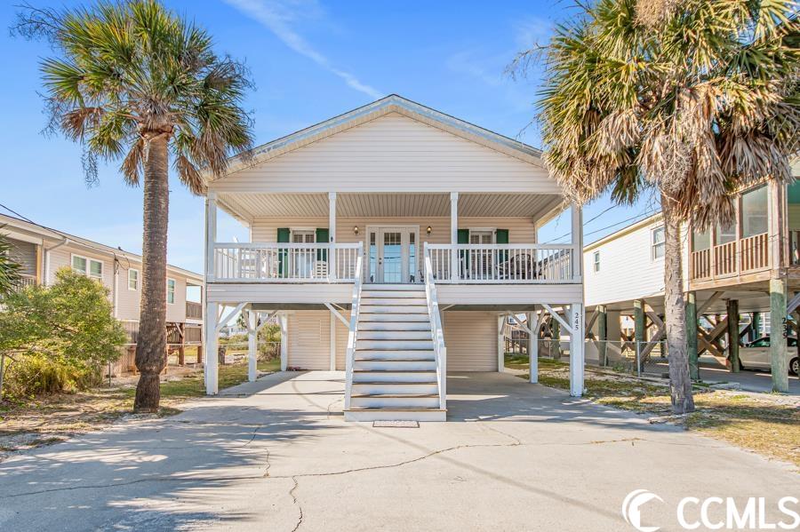 welcome to paradise in garden city, south carolina! this stunning 6-bedroom, 4-bathroom beach house offers the epitome of coastal living with breathtaking ocean views. immerse yourself in the soothing sounds of the waves and the gentle caress of ocean breezes just feet from your front door.  this spacious residence was once a small cottage built in the 1960's but underwent major renovations/addition in the late 1990s. the main living area, located on the second floor, provides ample space for family, friends, or guests. the open-concept living area is flooded with natural light, creating an inviting atmosphere that seamlessly blends with the coastal surroundings.  the coastal-cottage style kitchen is off the dining area and has a large pantry for all of your storage needs. down the hall from the kitchen, you’ll find three full bathrooms, four bedrooms, and a large laundry room. in addition to the bedrooms on the main floor, there are two bedrooms with a shared full bathroom on the lower level.  if you’re searching for additional space to entertain, watch the 4th of july fireworks, or enjoy the salty southern air, the home has a 341 square foot front porch with views of the atlantic ocean. the 341 square foot back porch has gorgeous sunset views peeking over the tidal creek and into murrells inlet.  rinse off after a beautiful beach day in the outdoor shower located on the ground level. there are 6 covered and 8 uncovered parking spaces for a total of 14 vehicles. the hvac was replaced in 2022 followed by the water heater replacement in 2023.  located within 2 blocks of the home are restaurants, shops, bars, and the iconic garden city pier that will excite any fisherman. the myrtle beach international airport is 11 miles away, and charleston is 77 miles away, making it perfect for a day trip. myrtle beach is known as the “golf capital of the world” and boasts over 90 golf courses of all levels.  if you're not convinced yet, located within a 2-mile golf cart ride, marlin quay marina offers boat slip rentals, fishing charters, parasailing, and has a restaurant on-site.