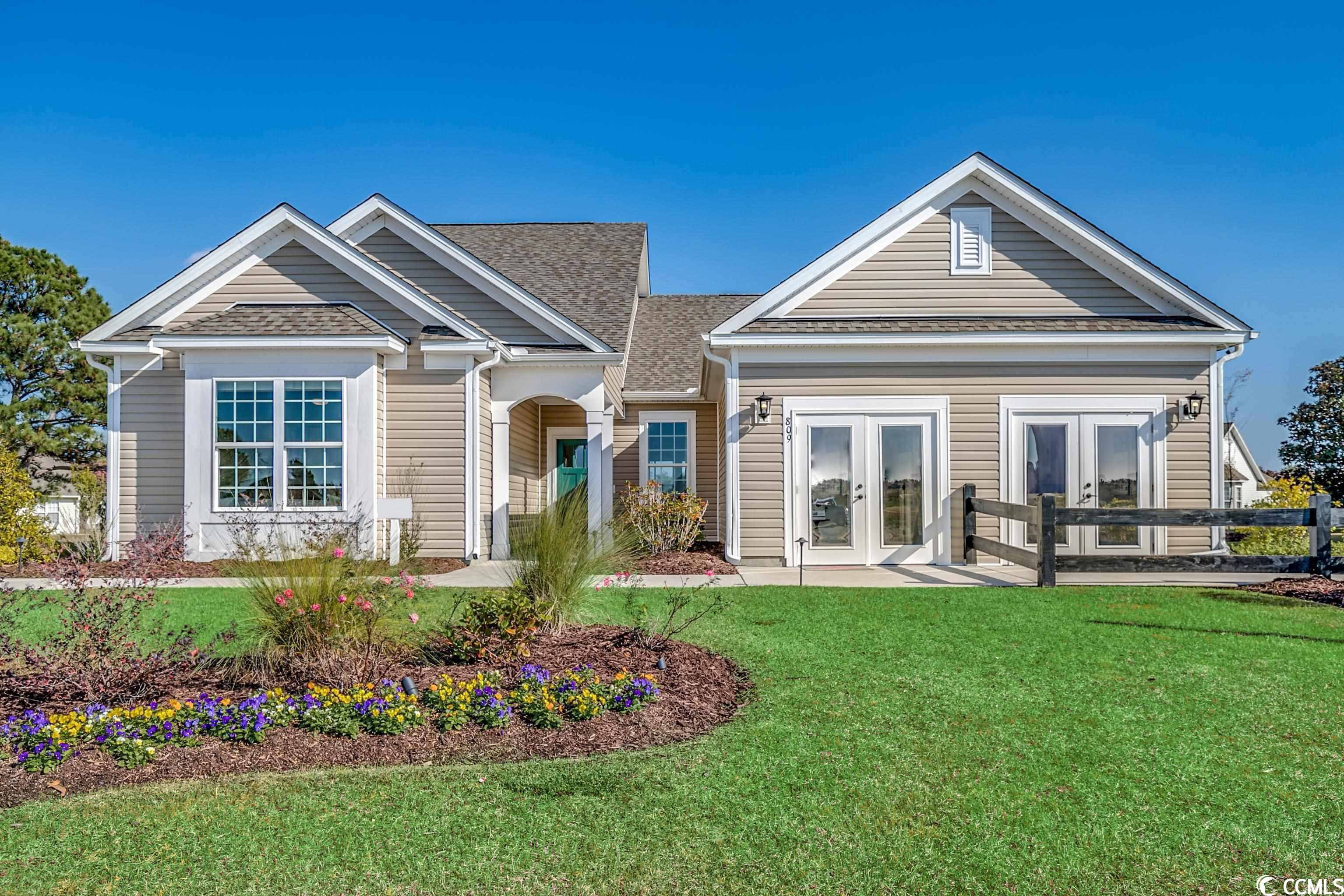 the beloved and very popular reynolds model home is now available for sale!  this well-appointed home features an open concept design, 3 bedrooms, 2.5 baths, a loft, a screened porch, and an outdoor living area equipped with a fire pit, sitting wall, and grilling station.  a craftsman style front door opens into the foyer and dining room which boasts a tray ceiling, chair rail, picture molding, and crown molding.  the great room offers a marvelous, vaulted ceiling.  the kitchen includes level 3 staggered height crisp white cabinets with crown molding and a glass mullion, an angled quartz island, under cabinet lights, whirlpool stainless steel appliances (natural gas range, over the range microwave vented to the exterior, dishwasher, and side-by-side refrigerator), level 3 backsplash tile, and a breakfast nook with a lovely view of the .50-acre lot.  the primary bedroom features a soaking tub, walk-in shower with a moen hand-held sprayer, double vanity, and water closet.  bedrooms 2 and 3 are separated by a jack-and-jill bath.  upstairs offers the privacy of a loft with the mechanical room that creates a protected, climate-controlled space for the hvac/furnace.  the 2-car garage includes attic storage with pull-down stairs.  this beautiful model home offers lots of natural light and lovely color choices that flow from room to room.  an energy star certified home attractively equipped with oil rubbed bronze moen plumbing fixtures, oil rubbed bronze progress lighting fixtures, door hardware, and so much more.  located on a cul de sac with only 2 other homes and the community clubhouse and pool.  amenities include a convenient location 2.5 miles to the beach, a golf cart ride to shopping and dining, sidewalks and water views throughout, a community clubhouse with a gathering room, exercise room, catering kitchen, and pool.  the current welcome center will be turned into a 2-car garage.  this home is sold as-is.  sold unfurnished but the furniture is available for sale.