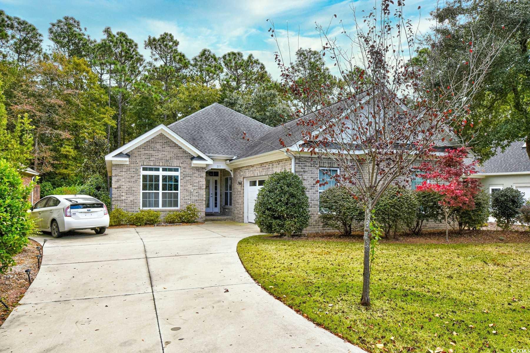 welcome home to this 3 bedroom, 2 bathroom home in the prestigious gated community of heritage plantation in pawleys island. this home features a spacious open floor plan of the main living areas with updated lvp flooring in every room. the kitchen is equipped with all stainless steel appliances, granite countertops, a work island with a gas range and range hood, and room for a breakfast table, separate from the more formal dining room just off the main living room. an additional den off the living room offers a fireplace as a main focal point in a second living space that could be used as an office, game room, playroom, you name it! each bedroom offers a ceiling fan, plenty of closet space, and easy access to a bathroom while the master suite also offers tray ceilings, and access to its own bathroom with an upgraded sink vanity and luxurious tiled walk in shower. enjoy afternoons on your extended back patio in the privacy of the backyard with a protected wooded view, and spend your days socializing with friendly neighbors at the community pool, clubhouse, & tennis courts.  heritage plantation is known for its golf courses and incredible location on the intracoastal waterway & waccamaw river, close to all of the area's finest dining, shopping, and entertainment attractions. you won't want to miss this. schedule your showing today!