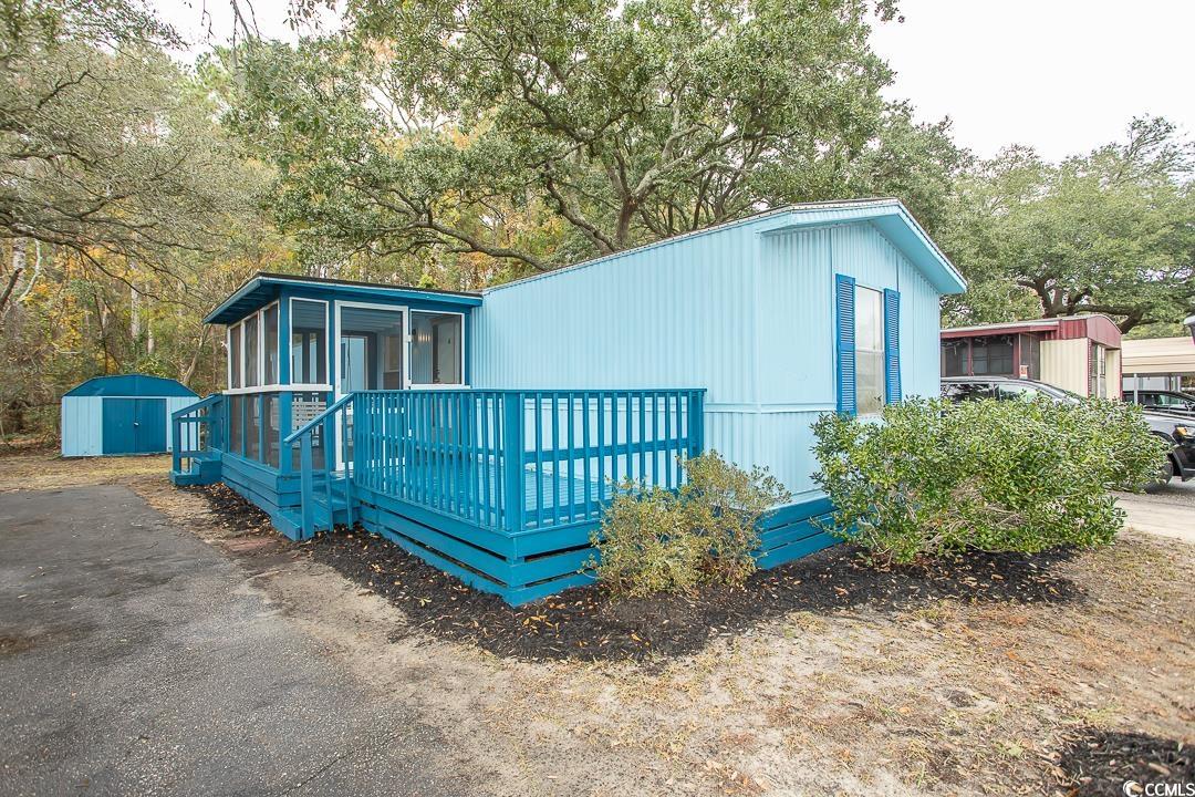 bright and cheery living! this newly renovated home in popular inlet oaks 55+ community is a delight! updates include new luxury vinyl flooring throughout, new, enlarged (to ceiling) kitchen cabinets and counter, new vanities and other upgrades to both bathrooms, neutral fresh paint throughout plus new fixtures and lighting. exterior trim painted and new decking installed front and back. home located on outer edge of the park and backs to wooded area for added privacy.  a kitchen pantry, ample closets throughout and outdoor shed offer lots of storage plus separate laundry area. lot fee includes county property taxes, trash pick up and exclusive use of the park amenities including clubhouse and outdoor pool. close to shopping, fabulous brookgreen gardens and the famous murrells inlet marshwalk and beaches.