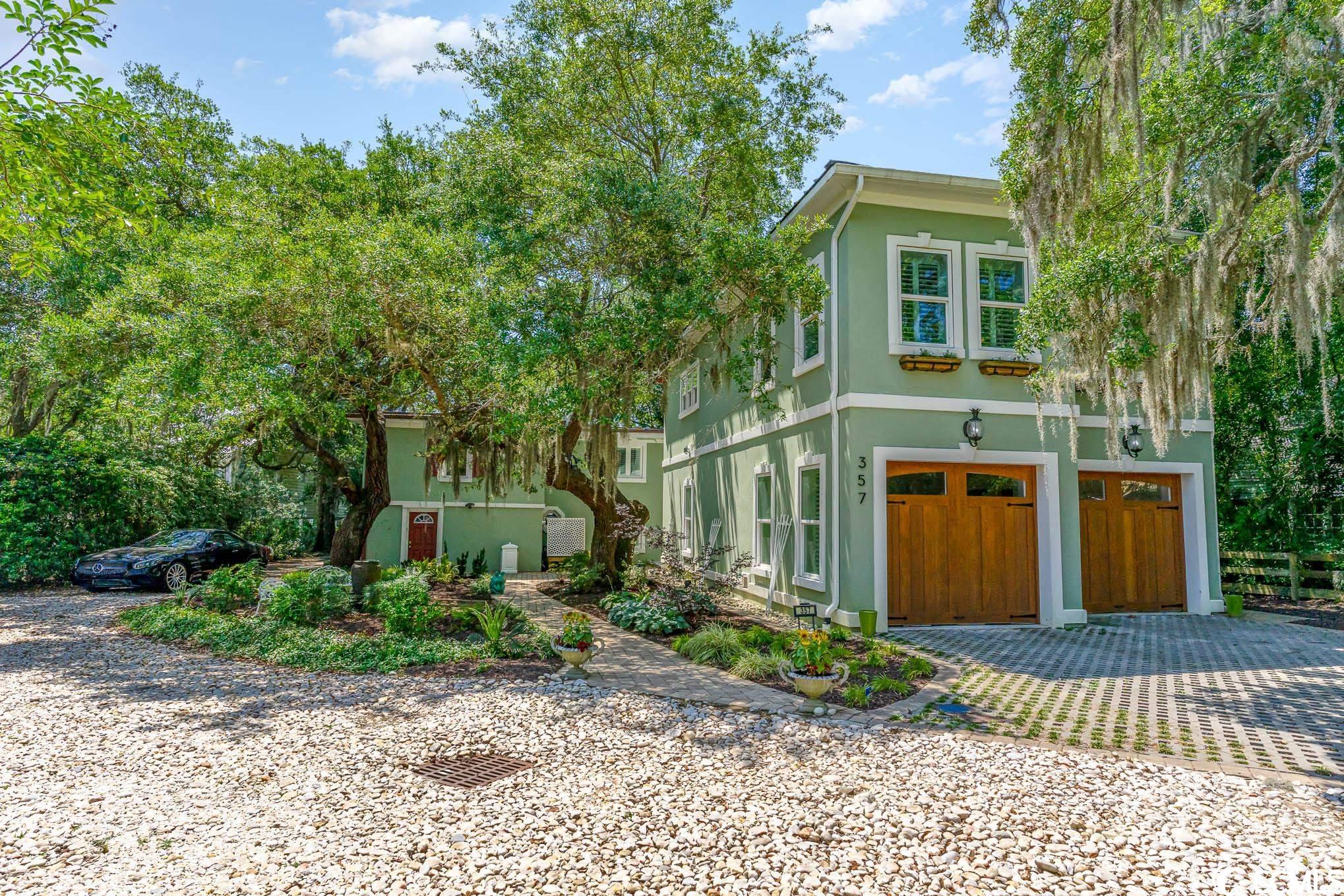 waterfront!! this stunning home has all the character of old charm meets luxurious modern in the highly desired location of murrells inlet! nestled amongst the lowcountry oaks and elegantly designed for your best southern living this beautifully designed home offers you 5 bedrooms & 3 1/2 baths with a split floorplan great for entertaining! from the moment you walk in you are captivated by the gorgeous murrells inlet water view's! the first level living area has inlet views throughout, features terracotta flooring, a cozy gas fireplace, 3 bedrooms including a primary suite, as well as a dining area & full kitchen, extravagant wet bar and sliding glass entry with amazing water view's, there are 2 kitchens, each has the state of the art design with stainless steel appliances. upstairs features white marble tile, a full kitchen with 2 large bedrooms and oversized spa like shower. enjoy your own personal gazebo, boat lift and dock that has the capacity of a 50ft vessel... a true backyard oasis! if you have a car collection or just need some extra storage check out this four car garage that is temperature controlled! if you love watching the ospreys and fish play & enjoy seeing breathtaking sunsets this home is for you! schedule your showing today!